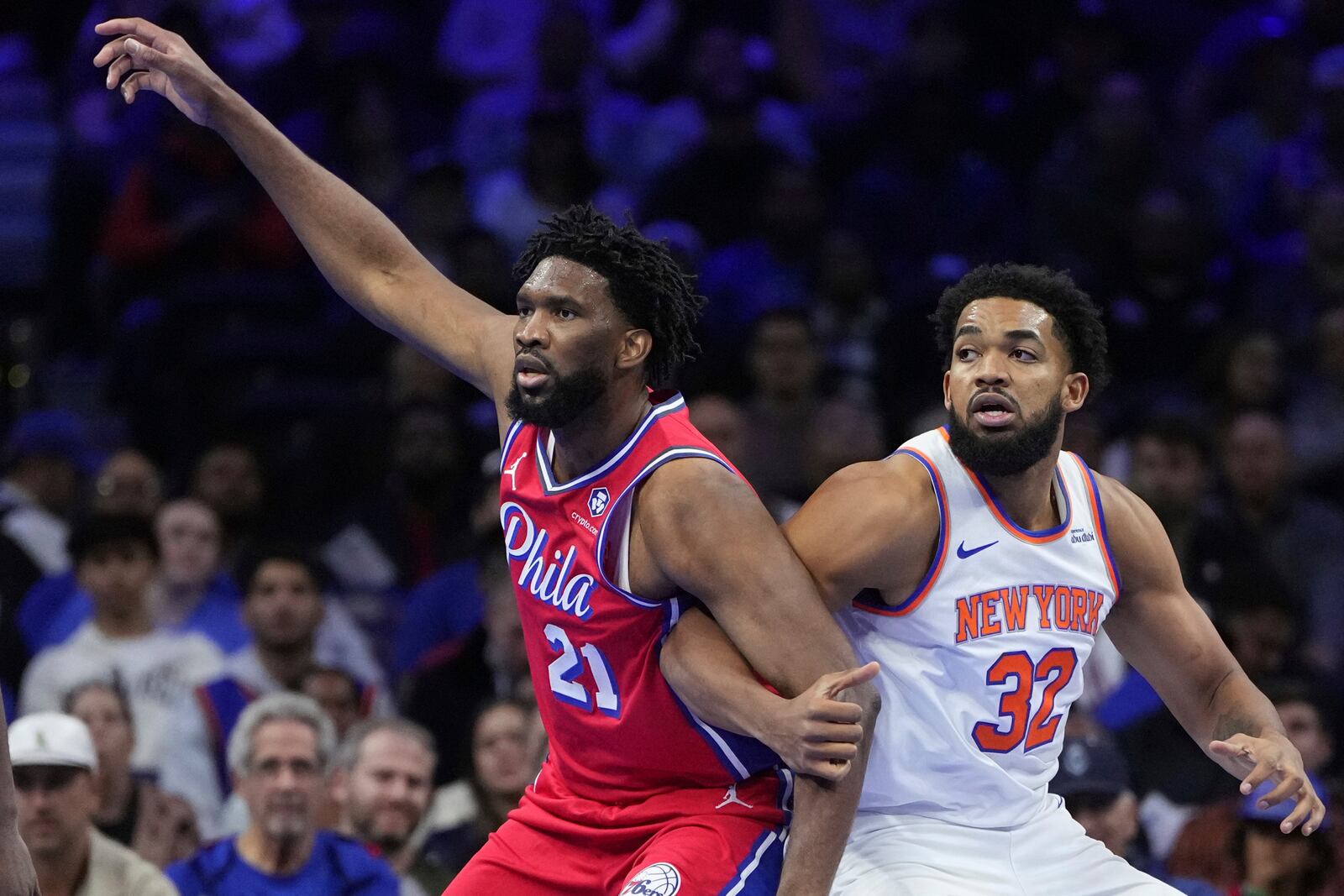 Philadelphia 76ers' Joel Embiid, left, and New York Knicks' Karl-Anthony Towns struggle for position during the first half of an Emirates NBA Cup basketball game, Tuesday, Nov. 12, 2024, in Philadelphia. (AP Photo/Matt Slocum)