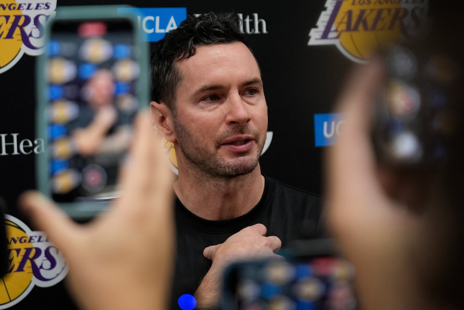 Los Angeles Lakersc coach JJ Redick speaks about the Pacific Palisades wildfire during a news conference in El Segundo, Calif., Friday, Jan. 10, 2025. (AP Photo/Damian Dovarganes)