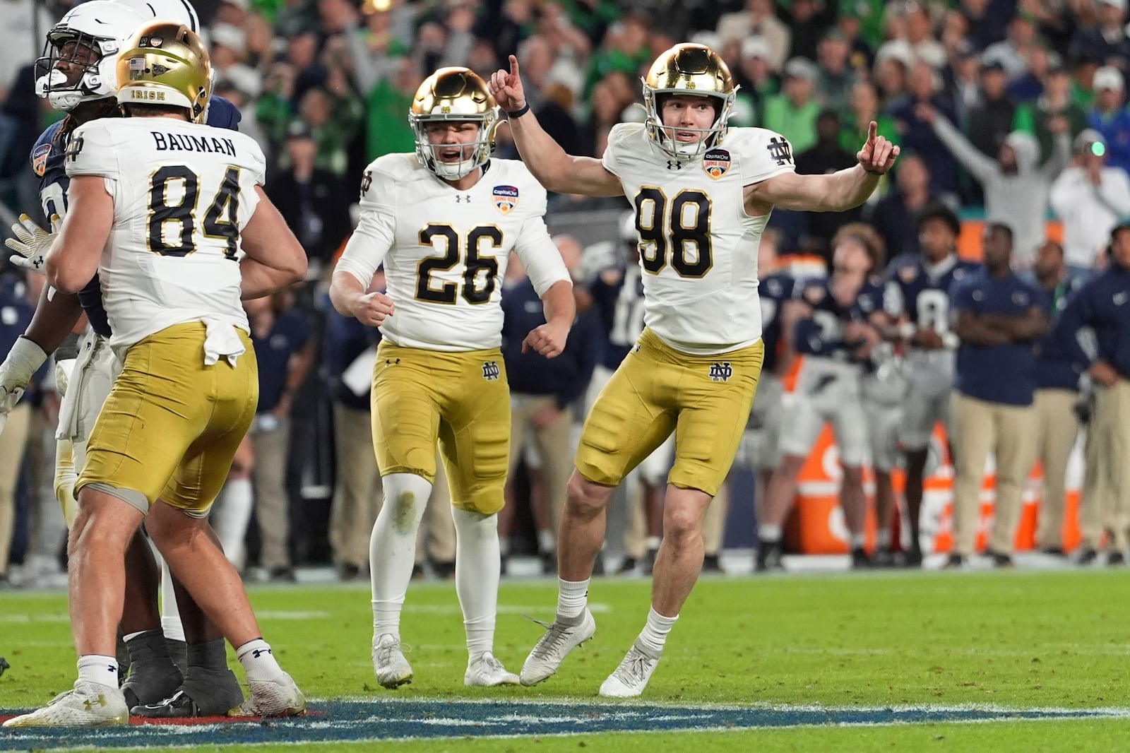 Notre Dame place kicker Mitch Jeter (98) celebrates after kicking the game winning field goal during the second half of the Orange Bowl College Football Playoff semifinal game against Penn State, Thursday, Jan. 9, 2025, in Miami Gardens, Fla. (AP Photo/Rebecca Blackwell)