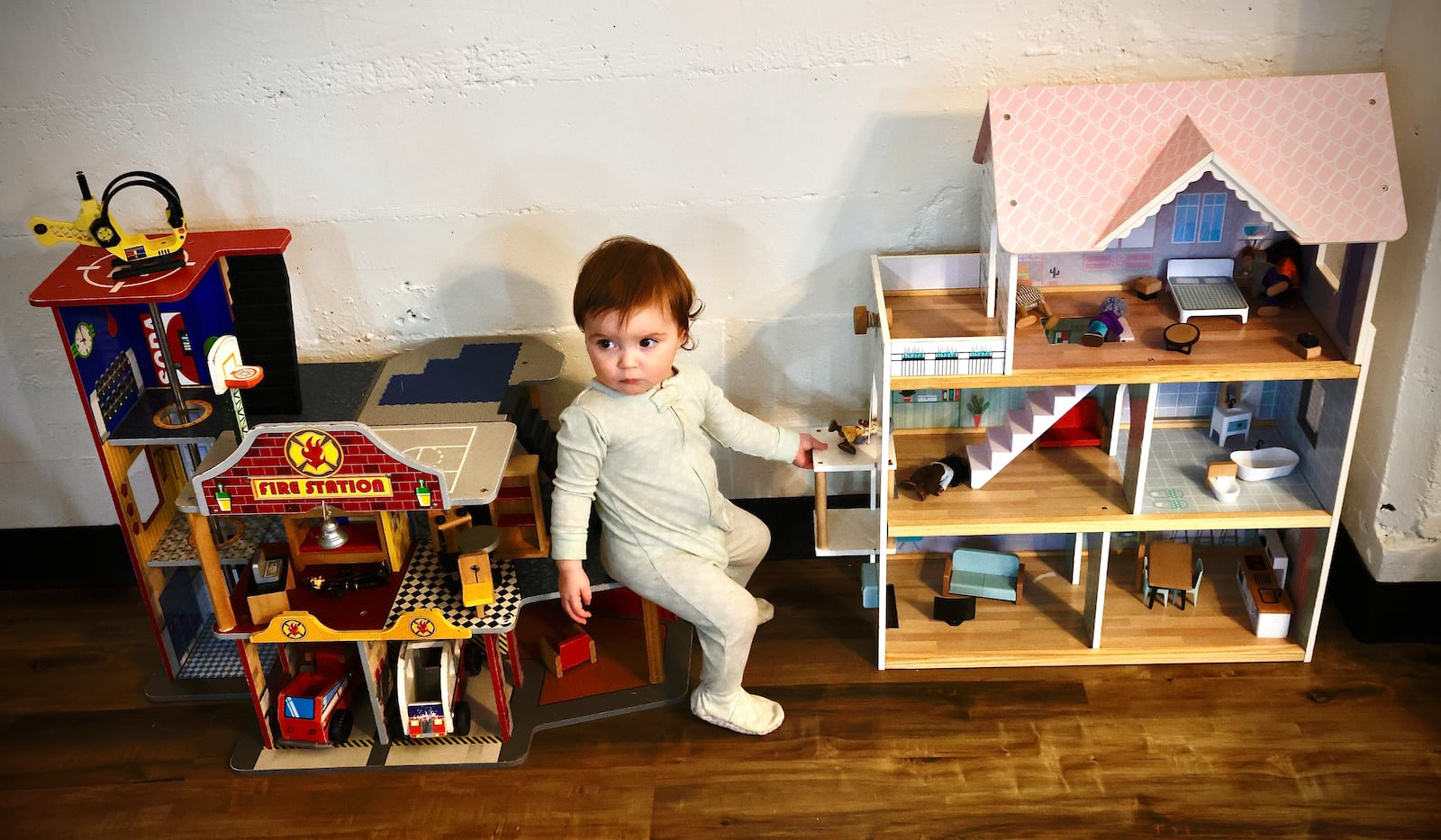 Elynor Angles, age 18 months, plays with doll houses Monday, Dec. 30, 2024 at the Building Block Play Studio in Springfield. MARSHALL GORBY \STAFF