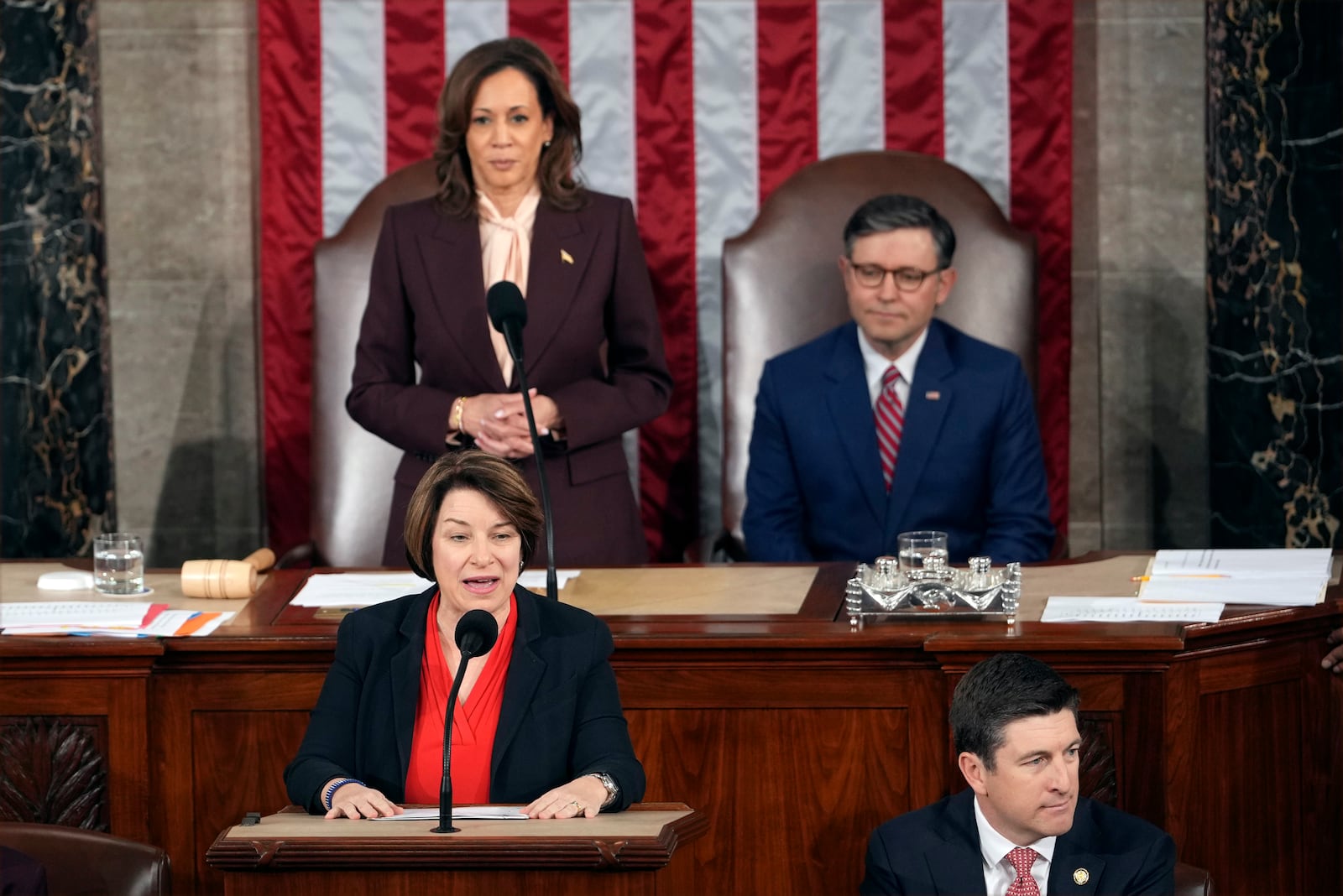 Vice President Kamala Harris and House Speaker Mike Johnson of La., listen as Sen. Amy Klobuchar, D-Minn., reads a certification during a joint session of Congress to confirm the Electoral College votes, affirming President-elect Donald Trump's victory in the presidential election, Monday, Jan. 6, 2025, at the U.S. Capitol in Washington. (AP Photo/Matt Rourke)