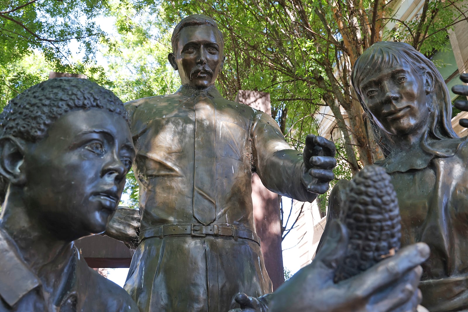 The statue of A.B. Graham in the pocket park along North Limestone Street Tuesday, June 11, 2024. BILL LACKEY/STAFF