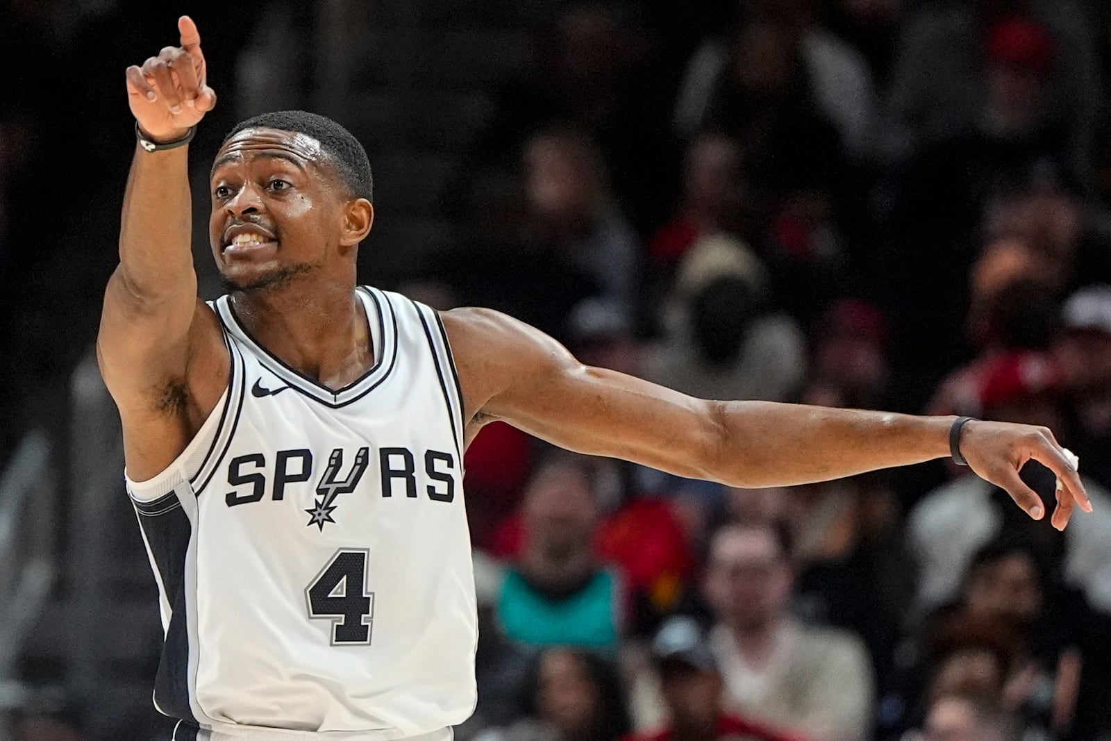 San Antonio Spurs De'Aaron Fox (4) reacts to play against the Atlanta Hawks during the first half of an NBA basketball game, Wednesday, Feb. 5, 2025, in Atlanta. (AP Photo/Mike Stewart)