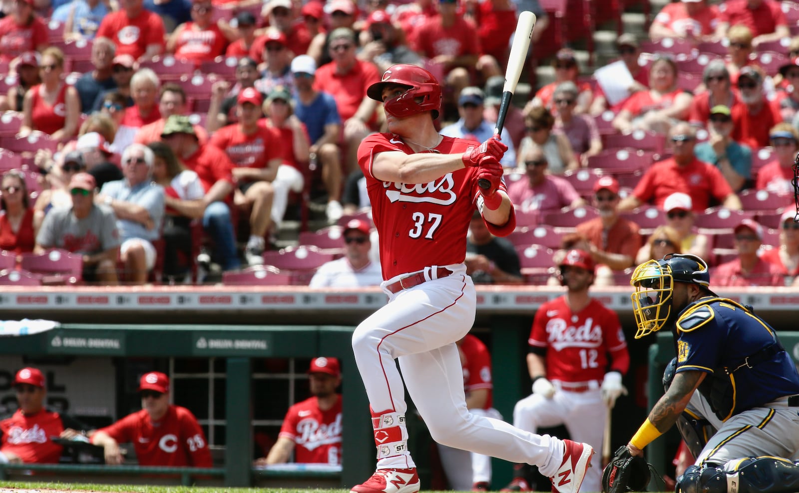 Tyler Stephenson, of the Reds, doubles to drive in three runs against the Brewers in the second inning on Wednesday, May 11, 2022, at Great American Ball Park in Cincinnati. David Jablonski/Staff