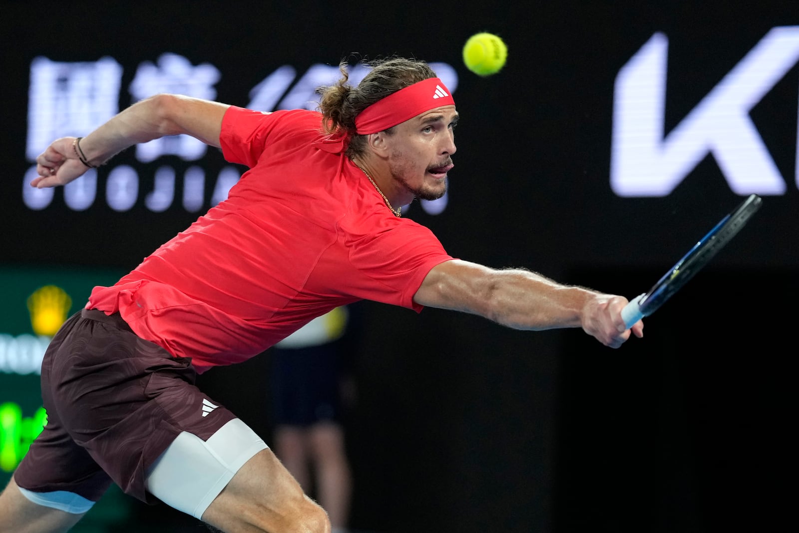 Alexander Zverev of Germany plays a backhand return to Jannik Sinner of Italy during the men's singles final at the Australian Open tennis championship in Melbourne, Australia, Sunday, Jan. 26, 2025. (AP Photo/Asanka Brendon Ratnayake)