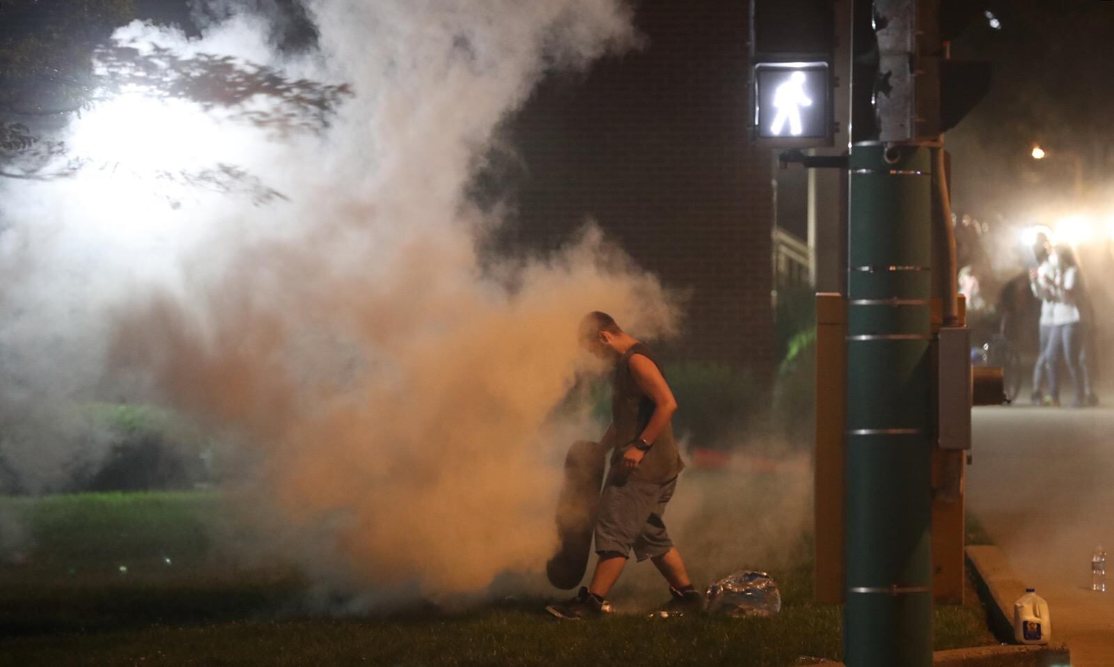 Springfield police used tear gas to disperse a crowd gathered near the Clark County Common Pleas Courthouse on Sunday night, May 31, 2020. The crowd remained from an afternoon march in protest following the death of George Floyd last week in Minnesota. BILL LACKEY / STAFF