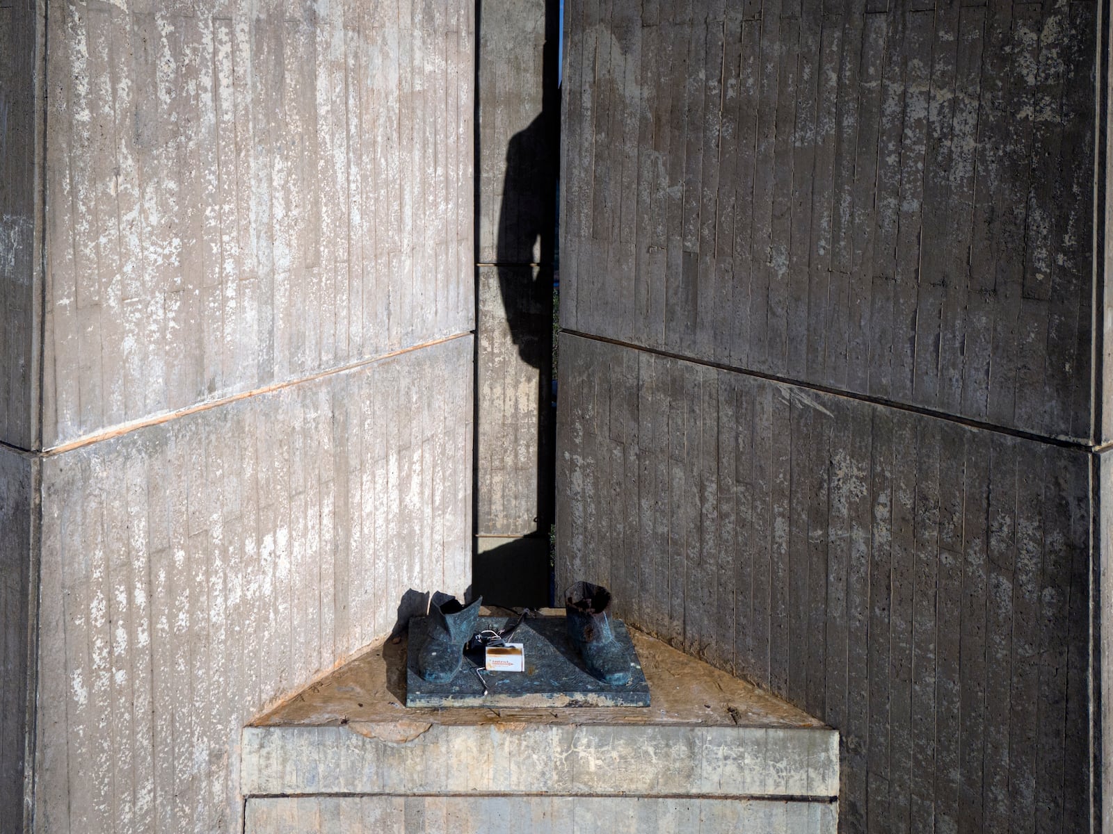 FILE - The feet are what remains of a statue of former dictator Gen. Alfredo Stroessner, that was removed decades prior, from Victory Peace Monument on Lambare Hill in Asuncion, Paraguay, Aug. 14, 2024. (AP Photo/Jorge Saenz, File)