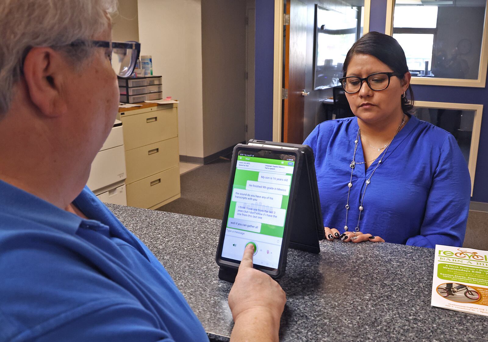 Dr. Pamela Shay and Lydia Martinez use one of the Translate Live devices to have a conversation in the Springfield School District's central registration office Tuesday, August 27, 2024. BILL LACKEY/STAFF