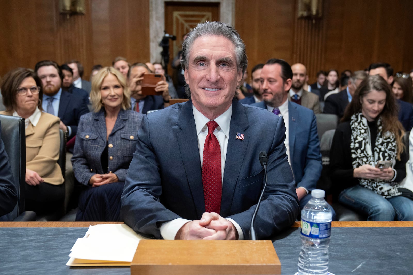 Former Gov. Doug Burgum, President-elect Donald Trump's choice to lead the the Interior Department as Secretary of the Interior, arrives to testify before the Senate Energy and Natural Resources Committee on Capitol Hill in Washington, Thursday, Jan. 16, 2025. (AP Photo/Jose Luis Magana)