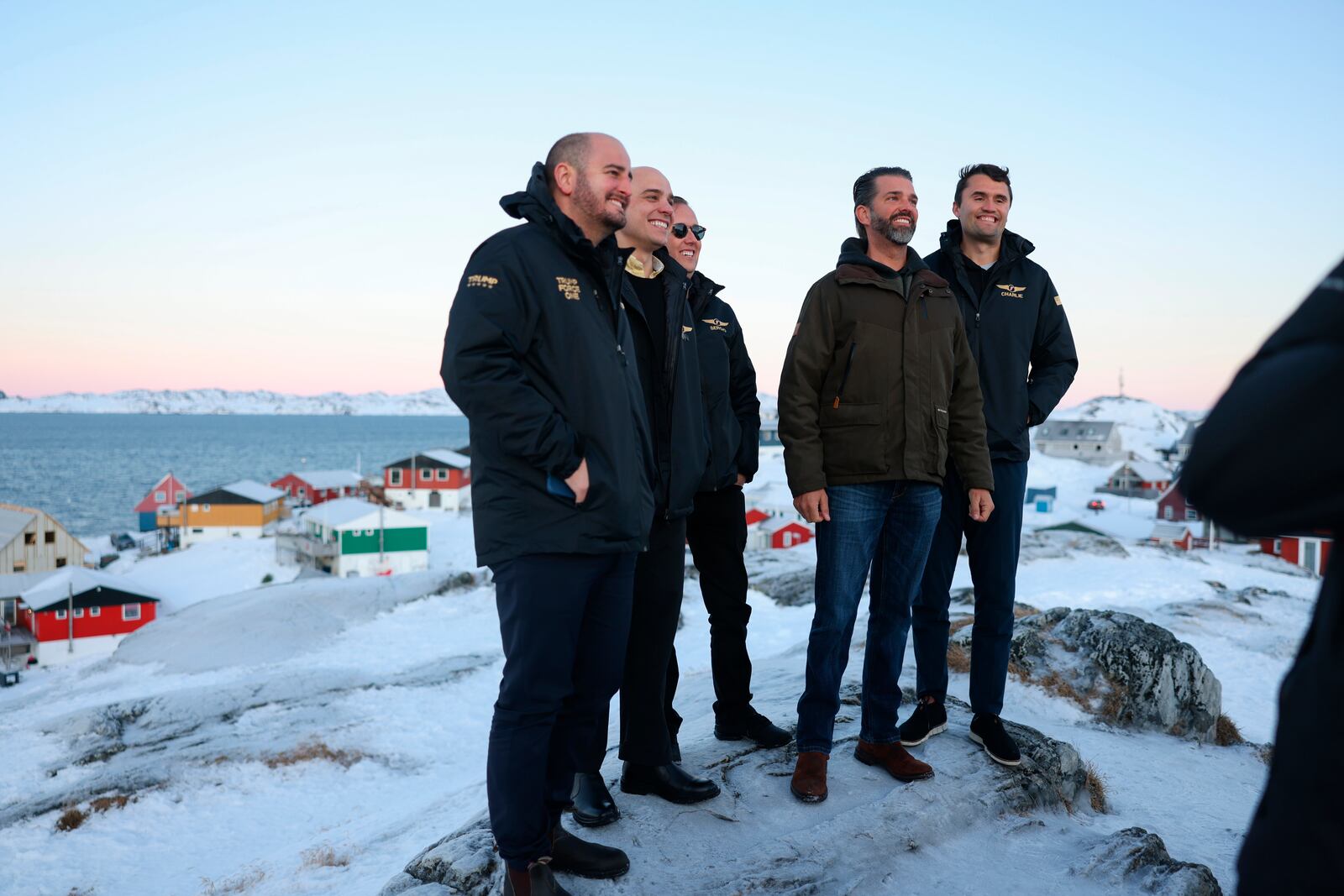 Donald Trump Jr., second right, poses for a picture upon his arrival in Nuuk, Greenland, Tuesday, Jan. 7, 2025. (Emil Stach/Ritzau Scanpix via AP)