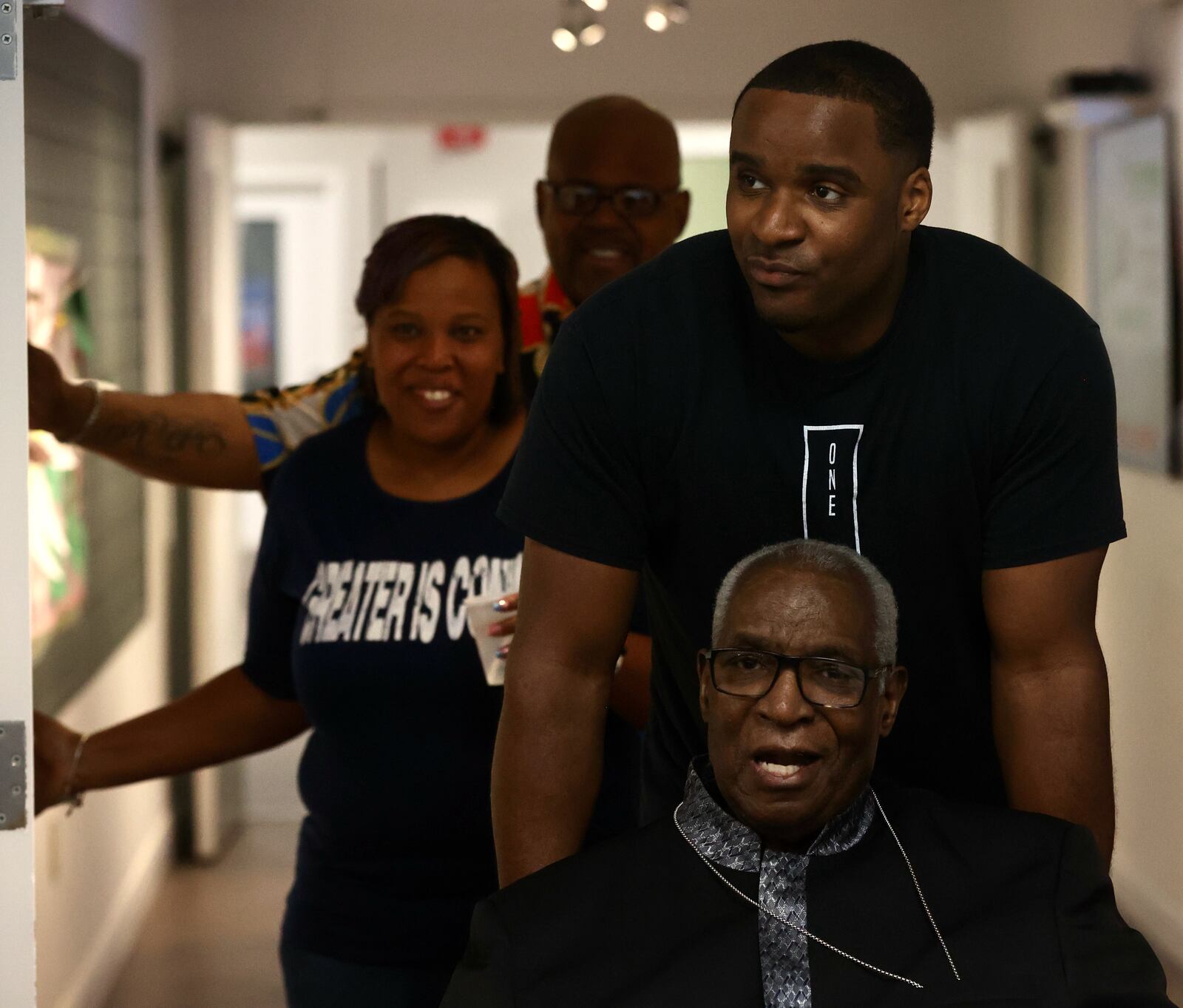 Michael Cooper II brings his dad, Michael Cooper Sr., of Springfield, into a service held in his honor on Sunday, May 21, at Trinity Community in Fairborn. David Jablonski/Staff