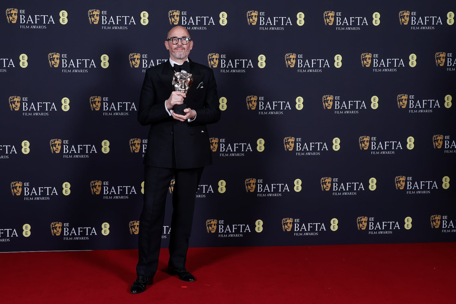 Edward Berger poses with the outstanding british film award for 'Conclave' at the 78th British Academy Film Awards, BAFTA's, in London, Sunday, Feb. 16, 2025. (Photo by Joel C Ryan/Invision/AP)