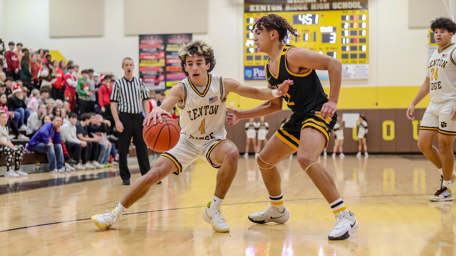 Kenton Ridge High School junior Mason Amato is guarded by Shawnee junior Adrian Jones during their game on Monday night at Kenton Ridge High School. The Braves won 38-33. CONTRIBUTED PHOTO BY MICHAEL COOPER