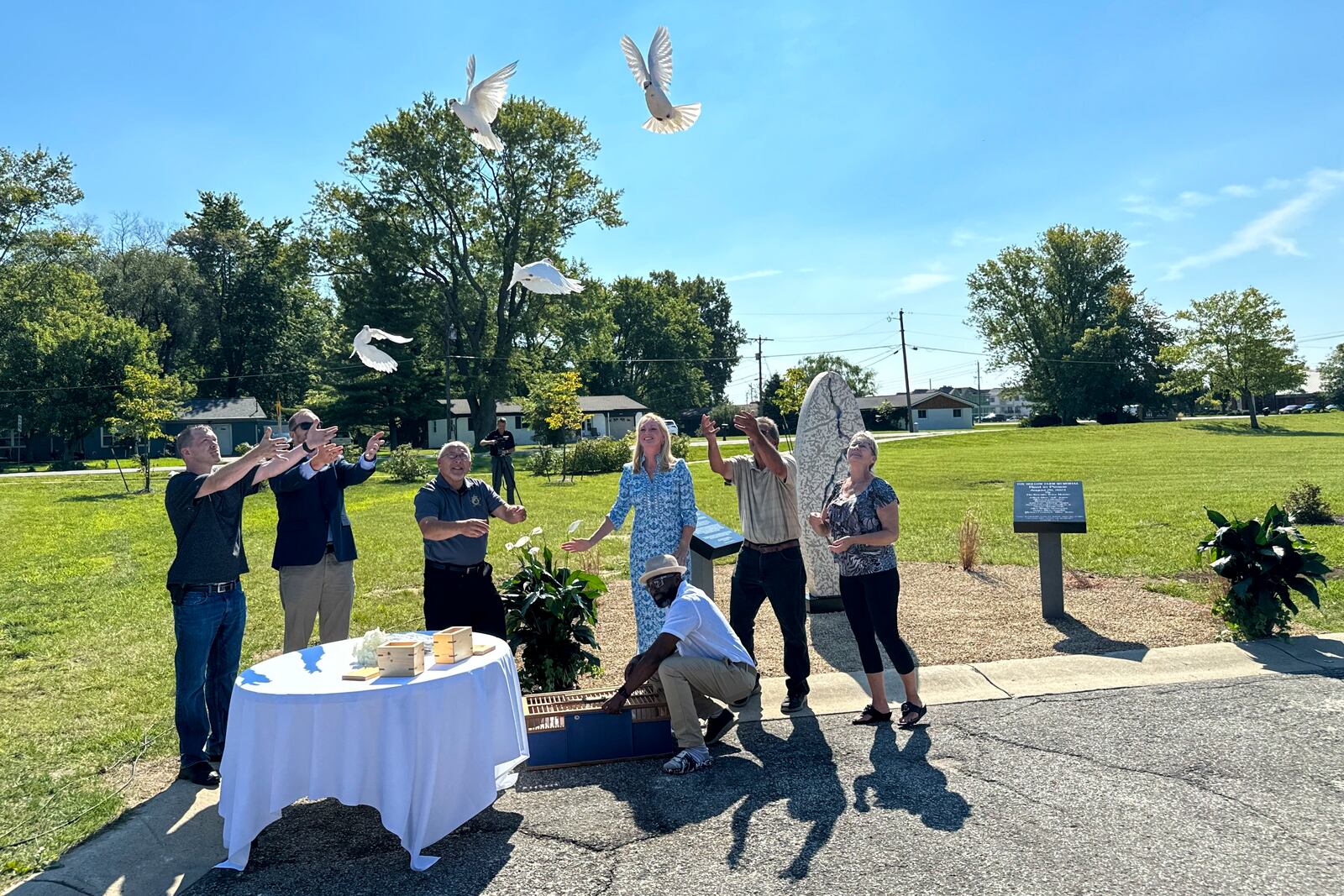 White doves are released on Aug. 29, 2024, in Westfield, Indiana, during the dedication of a memorial to the nine known victims of suspected serial killer Herbert Baumeister. (AP Photo/Rick Callahan)