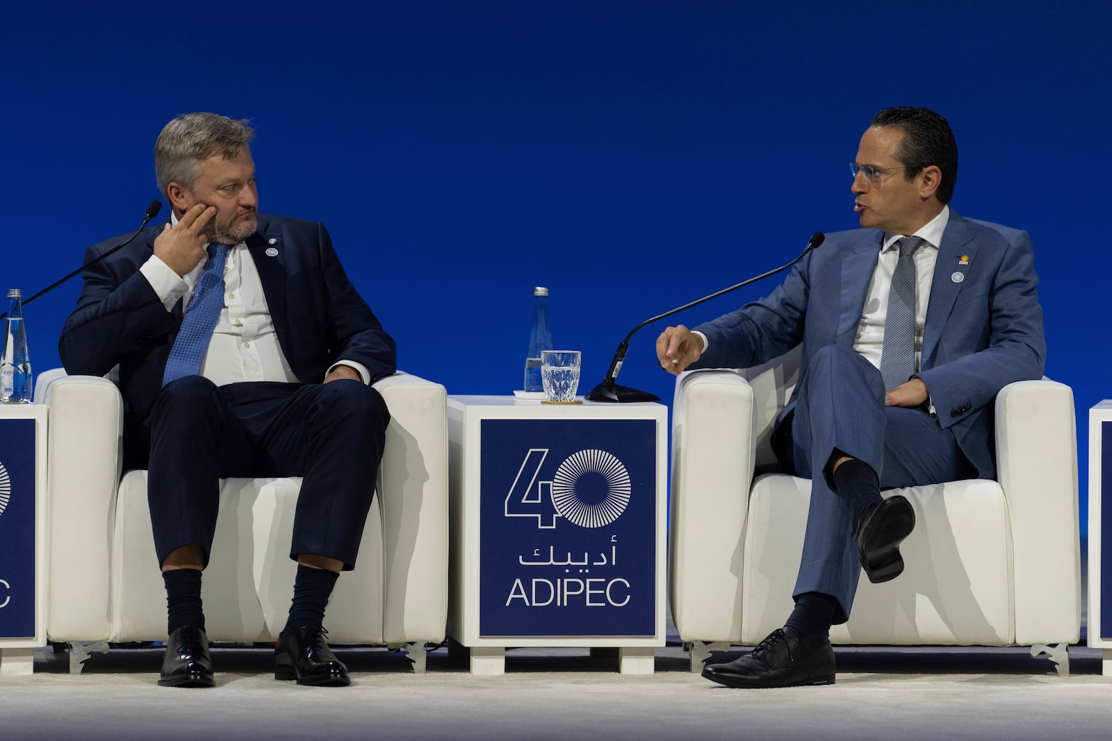 Murray Auchincloss CEO BP, left, watches as Wael Sawan CEO Shell, speaks during the Abu Dhabi International Petroleum Exhibition & Conference (ADIPEC) in Abu Dhabi, United Arab Emirates, Monday, Nov. 4, 2024. (AP Photo/Altaf Qadri)