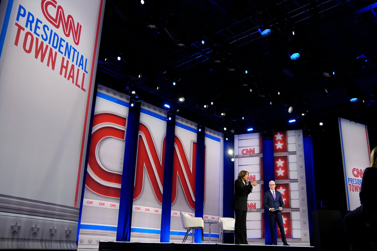 Democratic presidential nominee Vice President Kamala Harris speaks during a CNN town hall in Aston, Pa., Wednesday, Oct. 23, 2024, as moderator Anderson Cooper listens. (AP Photo/Matt Rourke)