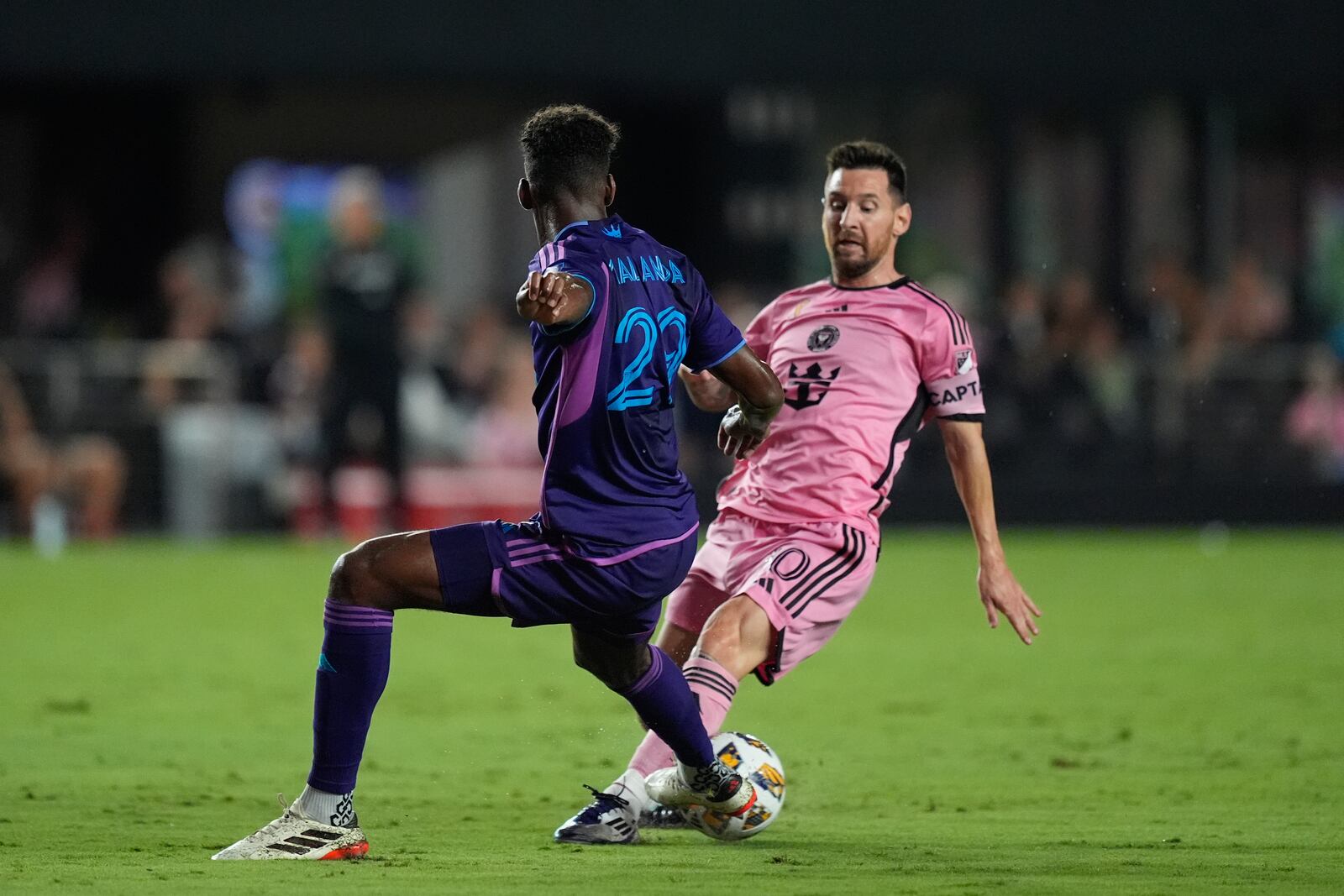 Inter Miami forward Lionel Messi (10), right, vies with Charlotte FC defender Adilson Malanda (29) during the first half of an MLS soccer match, Saturday, Sept. 28, 2024, in Fort Lauderdale, Fla. (AP Photo/Rebecca Blackwell)