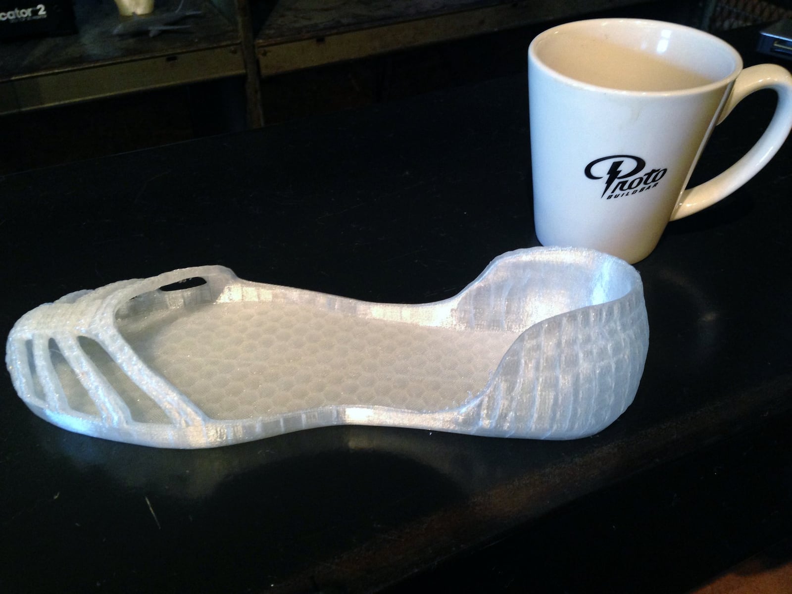 The possible applications for 3D printing technology are pretty mind blowing. Proto BuildBar owner Chris Wire sees a day when they will be in every household and used to to create items purchased on the Internet. This saddle is wearable if you can fit a size 9 shoe. Photo by Amelia Robinson