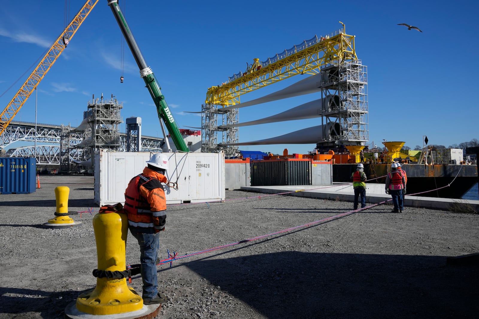 FILE - A generator and its blades are prepared at State Pier in New London, Conn., Dec. 4, 2023, to head to the ocean for the South Fork Wind farm. (AP Photo/Seth Wenig, File)