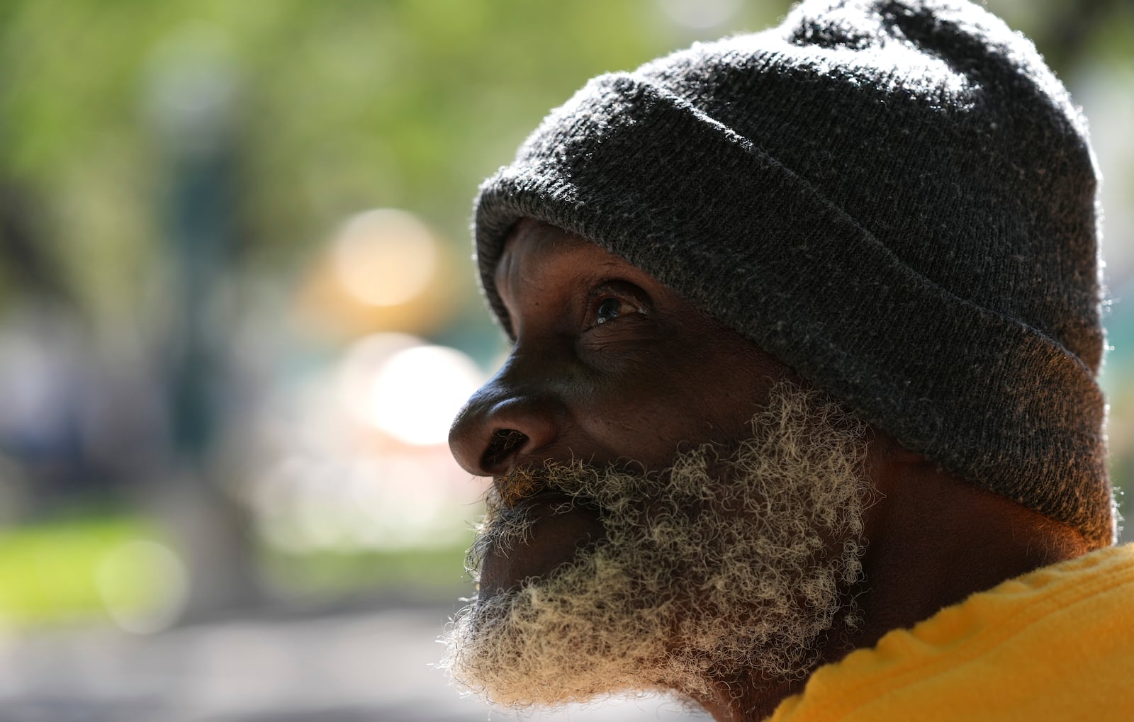 Willie Barnes, 63, who is homeless, talks with a homeless outreach advocate offering shelter as temperatures are forecast to be in the forties this evening Wednesday, Jan. 8, 2025, in Miami. (AP Photo/Lynne Sladky)