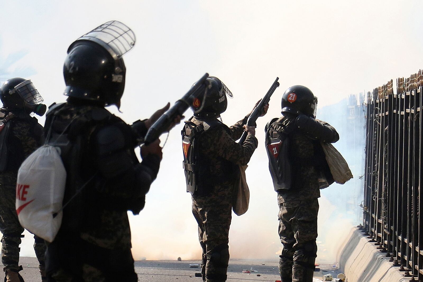 Paramilitary soldiers fire rubber bullets and tear gas shells to disperse supporters of imprisoned former premier Imran Khan's Pakistan Tehreek-e-Insaf party, during clashes at D-Chowk square close to Red Zone in Islamabad, Pakistan, Tuesday, Nov. 26, 2024. (AP Photo/Ehsan Shahzad)