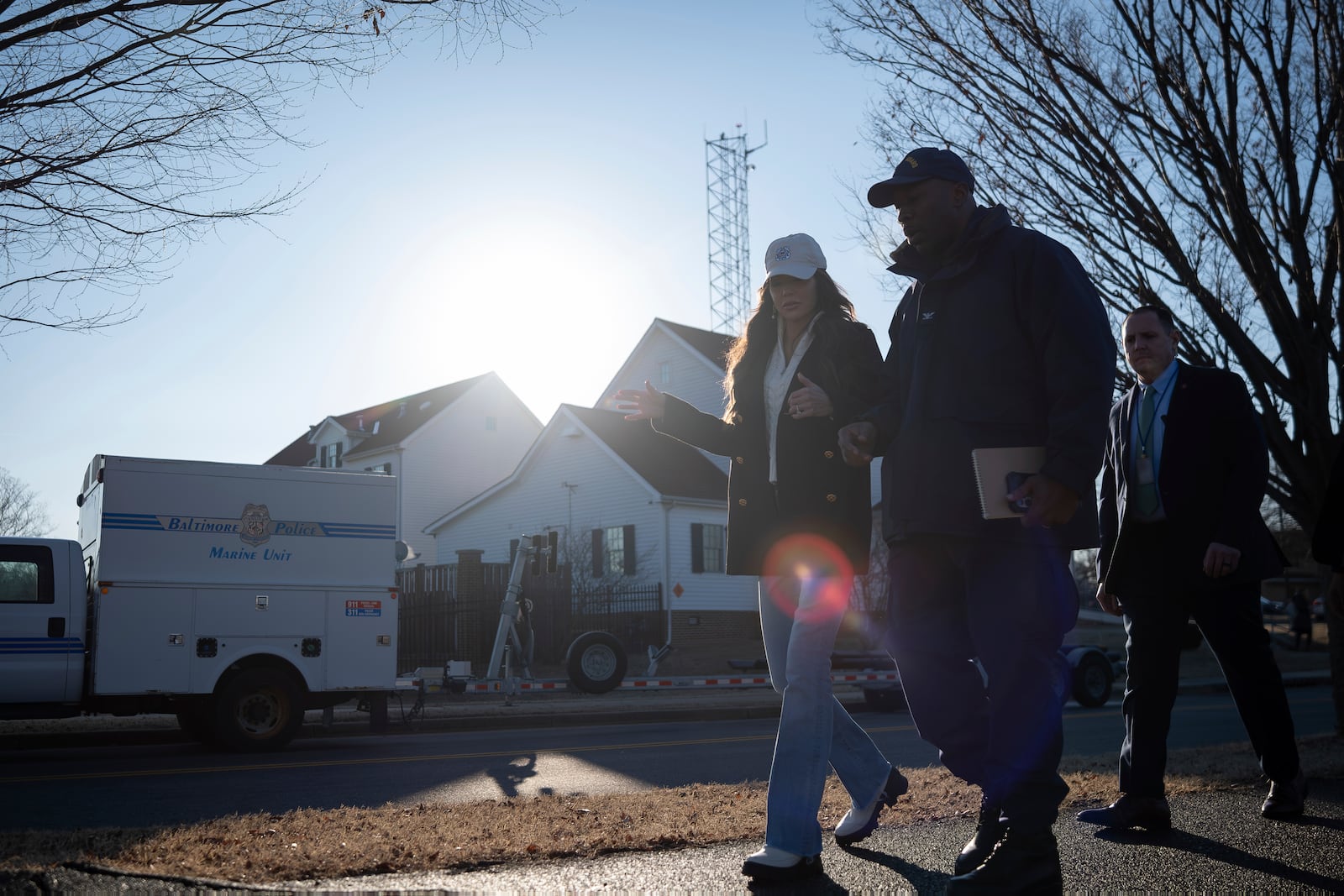 In this image provided by the U.S. Coast Guard, Secretary of Homeland Security Kristi Noem discusses response efforts with Capt. Patrick Burkett, commander, Coast Guard Sector Maryland - National Capital Region, outside Coast Guard Station Washington D.C., Thursday, Jan. 30, 2025 in Washington. (Petty Officer 1st Class Brandon Giles, U.S. Coast Guard via AP)