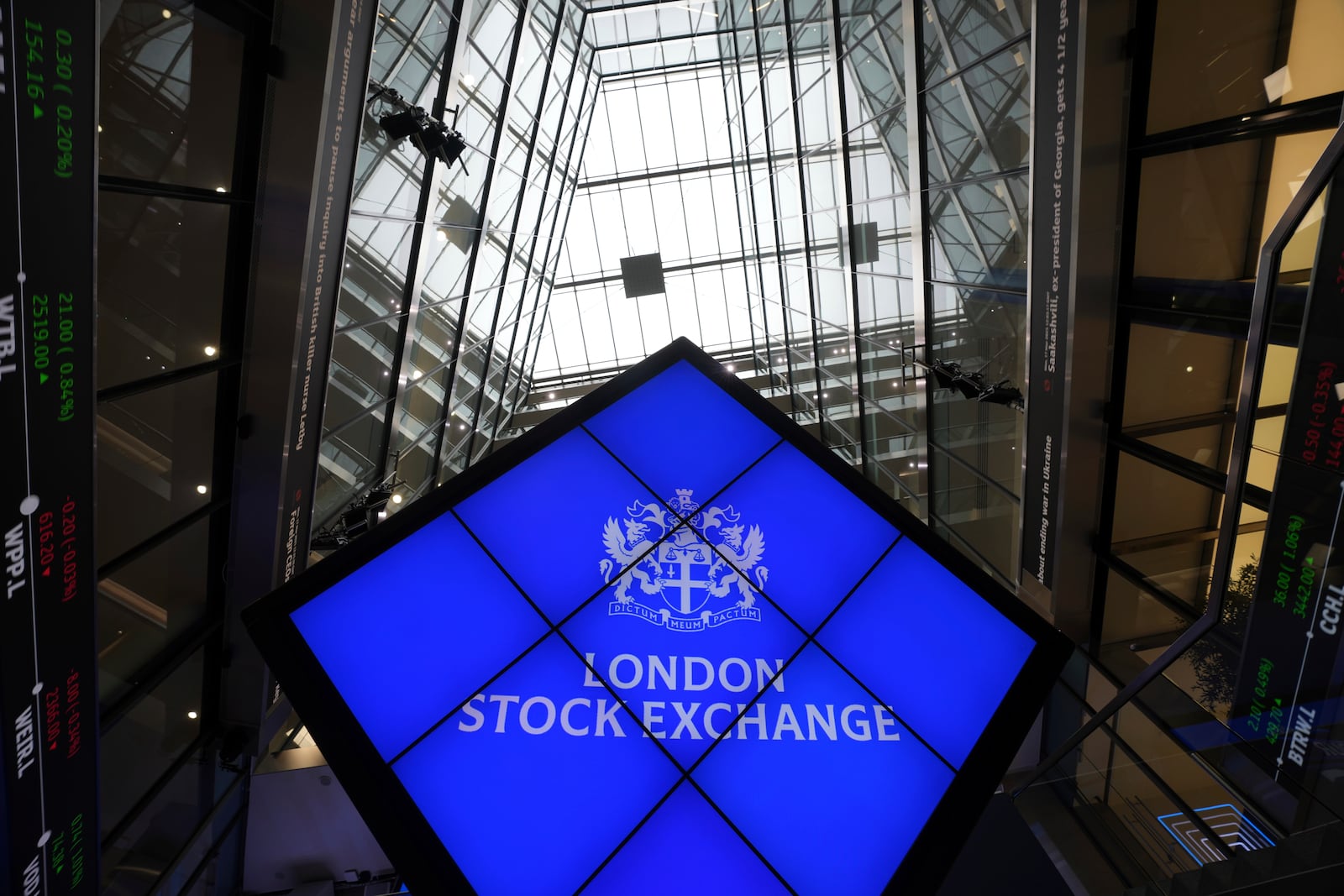 A logo is displayed inside the London Stock Exchange, in the City of London, Monday, March 17, 2025. (AP Photo/Kin Cheung)