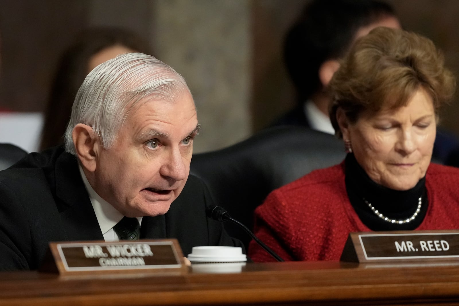 Sen. Jack Reed, D-R.I., the committee ranking member, left, speaks during the Senate Armed Services Committee confirmation hearing for Pete Hegseth, President-elect Donald Trump's choice to be Defense secretary, at the Capitol in Washington, Tuesday, Jan. 14, 2025. (AP Photo/Ben Curtis)