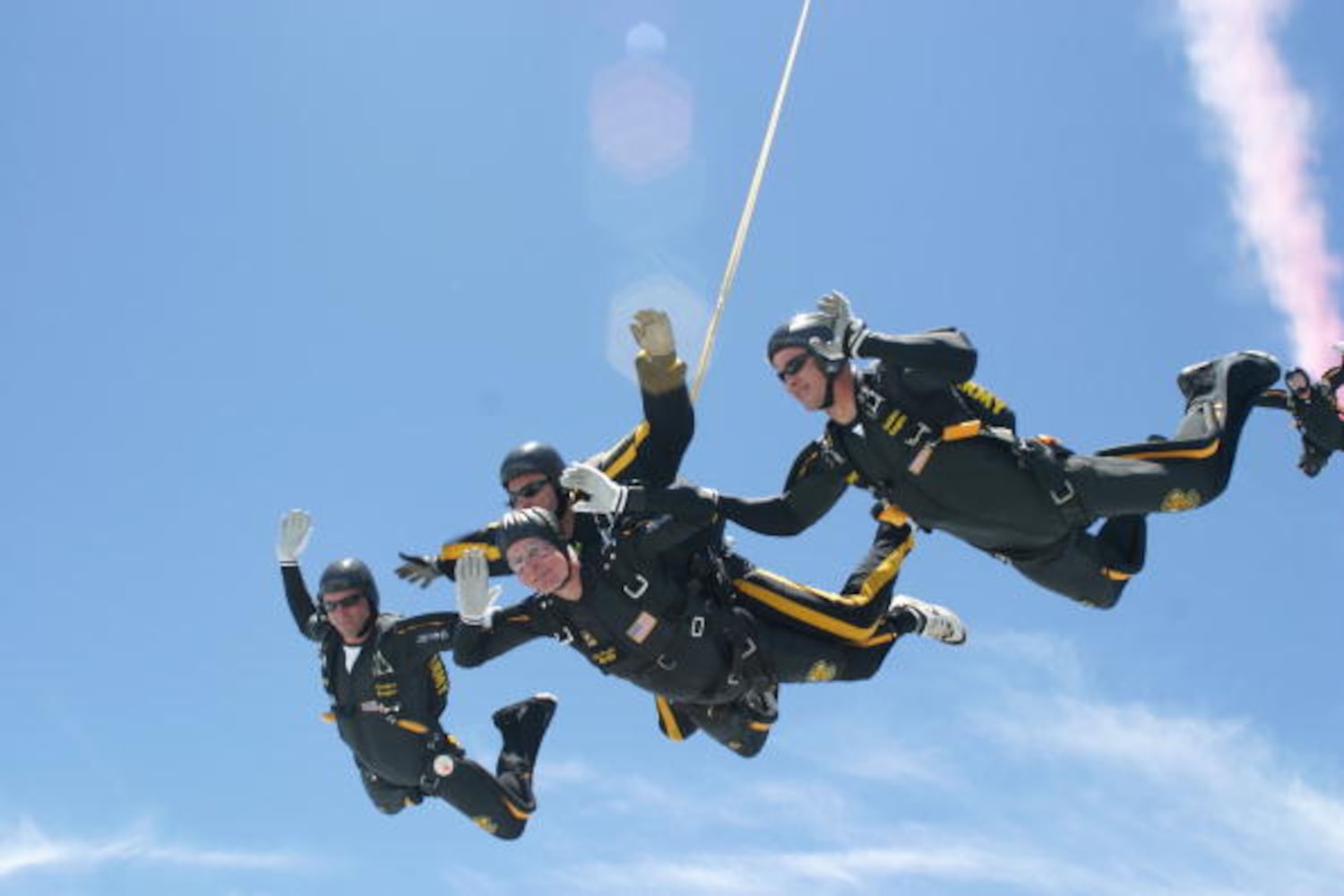 2004: George H.W. Bush performs a tandem parachute jump