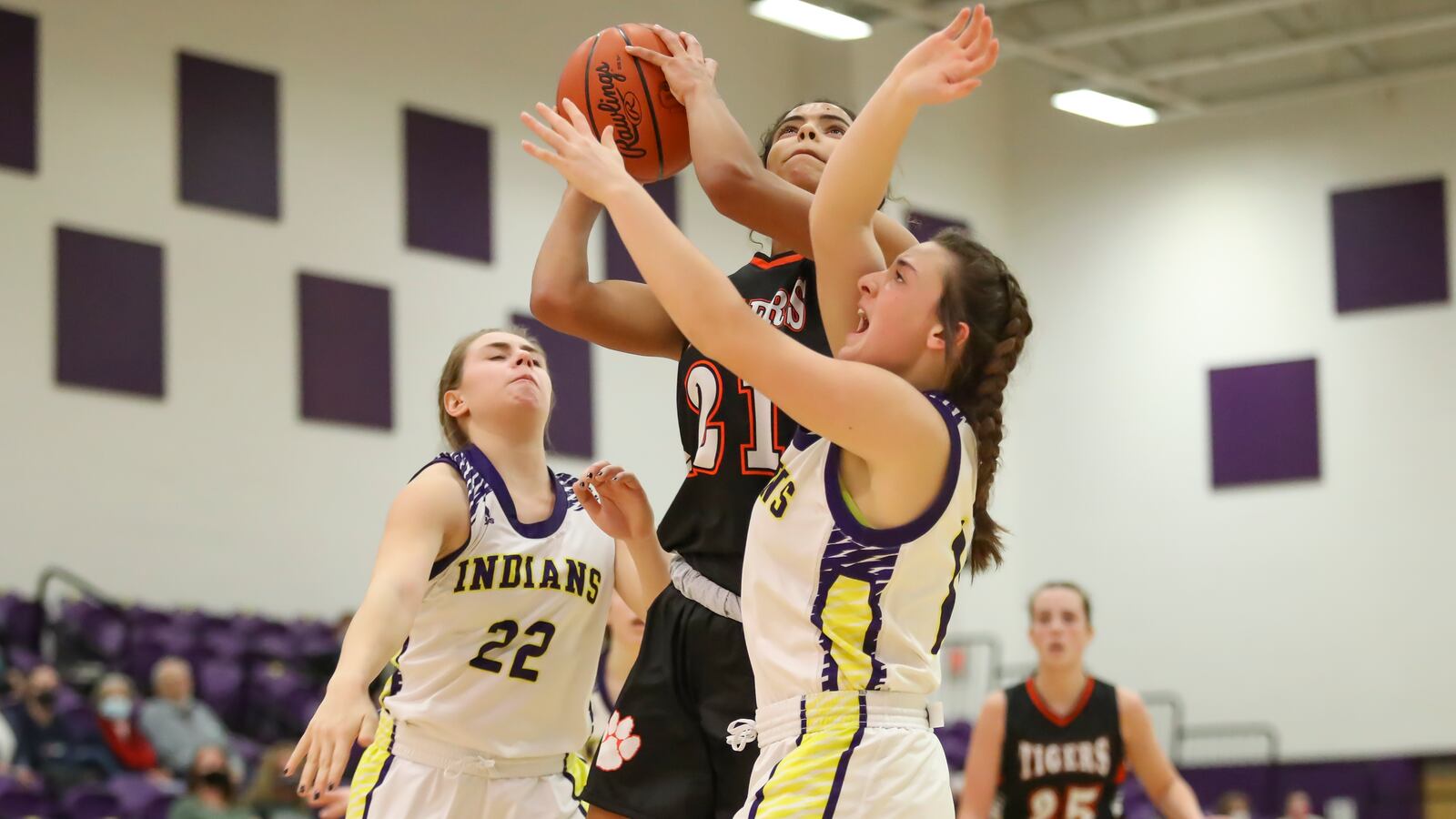 West Liberty-Salem senior Selena Weaver shoots the ball while be defended by Mechanicsburg's Taylor Rausch (right) and Elyse Wilson (left) during a game in Mechanicsburg. Michael Cooper/CONTRIBUTED