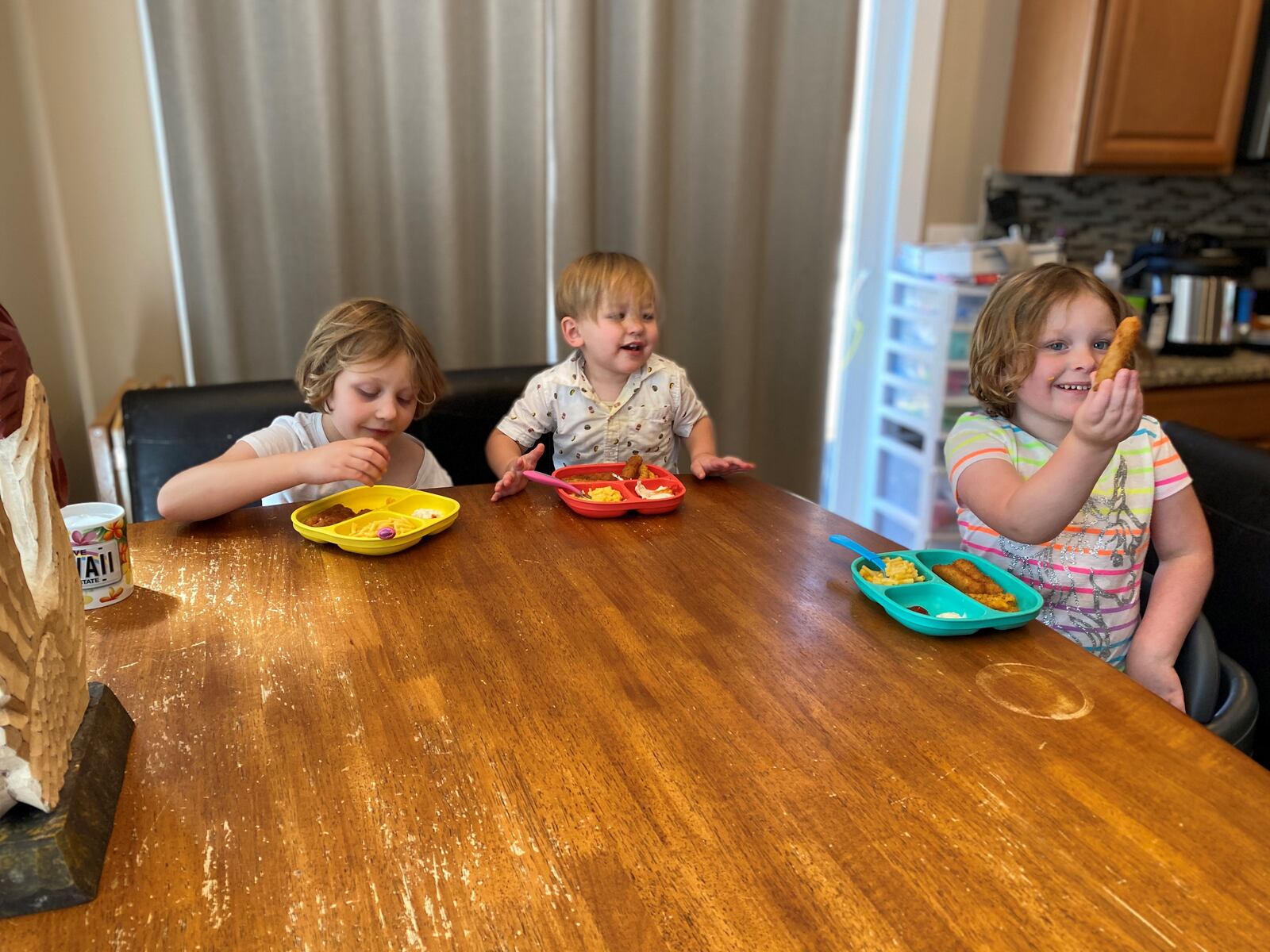 Alexis (from left), Bentley and Chloe Becker eat lunch during their break from school. Their mom, Tiffany plans their meals a week in advance to save prep time. CONTRIBUTED