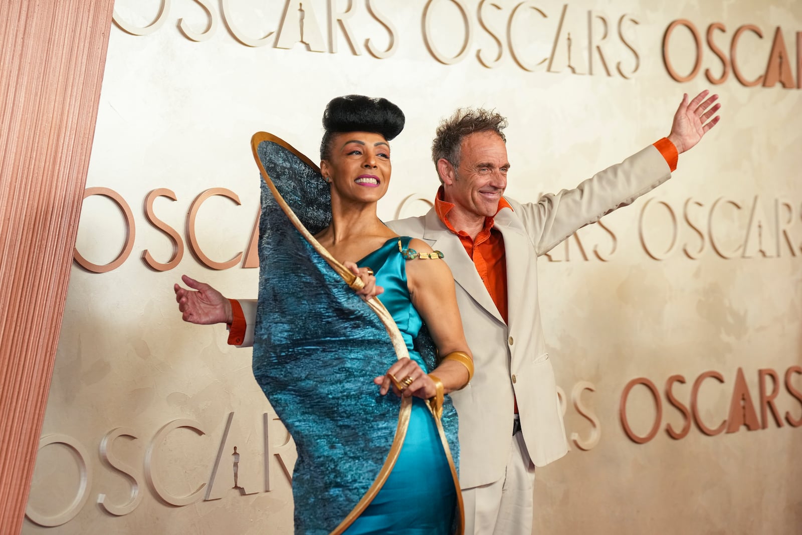 Kayo Shekoni, left, and Johan Grimonprez arrive at the Oscars on Sunday, March 2, 2025, at the Dolby Theatre in Los Angeles. (AP Photo/Jae C. Hong)