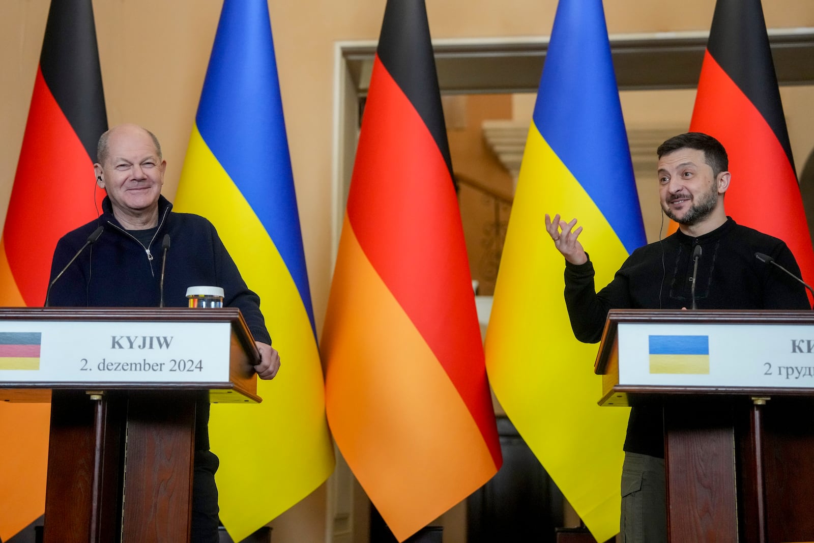 Ukraine's President Volodymyr Zelenskyy, right, and German Chancellor Olaf Scholz attend a press conference in Kyiv, Ukraine, Monday, Dec.2, 2024. (AP Photo/Evgeniy Maloletka)