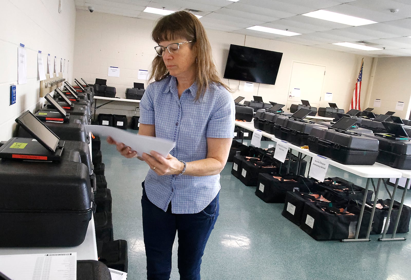 Loren Oliver helps get the voting equipment and supplies ready Monday, Nov. 6, 2023 at the Clark County Board of Elections before they go out to the different precints for Tuesday's election. BILL LACKEY/STAFF