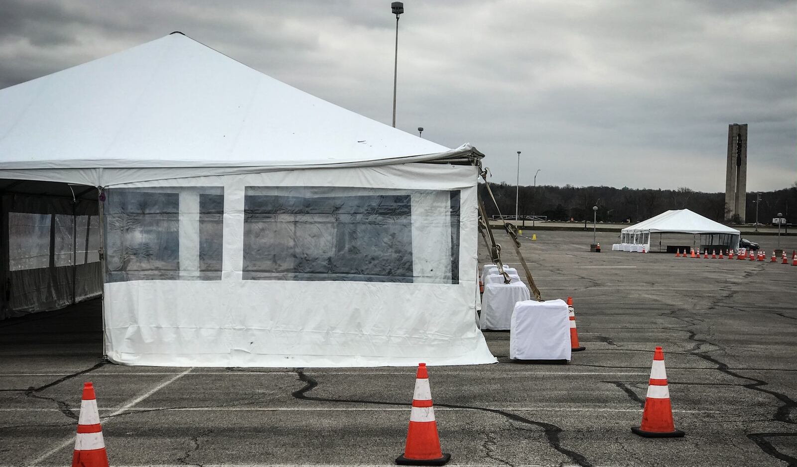 Tents were set up Monday in the University of Dayton Arena in preparation for drive-up coronavirus testing that will begin Tuesday, March 17, 2020.  JIM NOELKER/STAFF