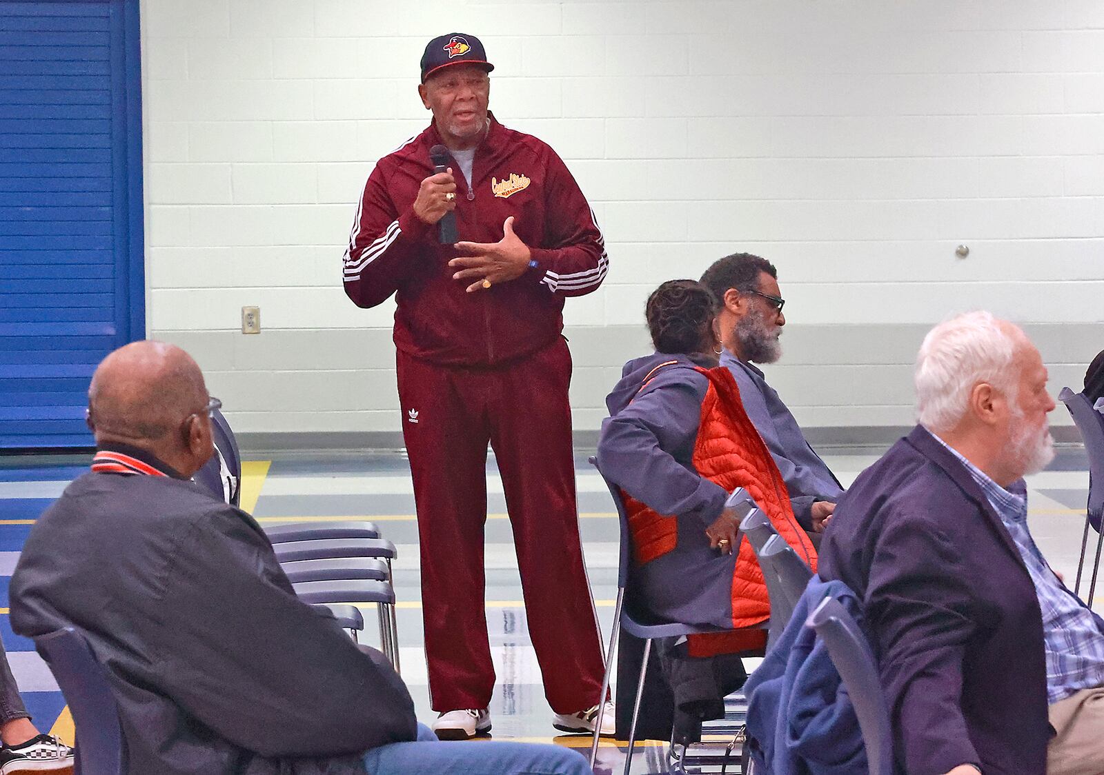 Springfield Coach Larry Ham, an audience member at a youth summit on gun violence, talks about how gun violence has effected his life Thursday, Dec. 8, 2022 at Springfield High School. The Summit was a partnership between the Springfield NAACP and the Springfield School District. The "Your Voice Youth Summit" was a teen-led coversation about gun violence, its impact and how th keep peace in the community. BILL LACKEY/STAFF