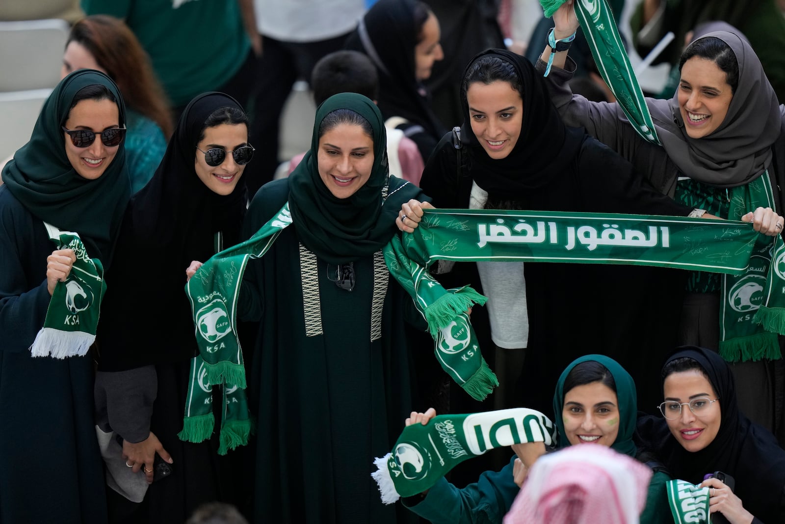 FILE - Saudi women supporters celebrate after Saudi Arabia won the World Cup group C soccer match between Argentina and Saudi Arabia at the Lusail Stadium in Lusail, Qatar, on Nov. 22, 2022. (AP Photo/Luca Bruno, File)