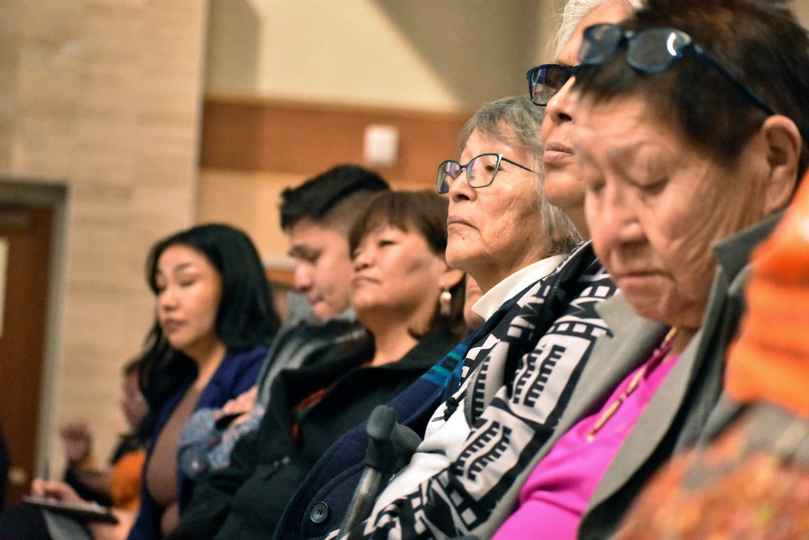 FILE - Elders from the Northern Cheyenne Tribe in southeastern Montana listen to speakers during a session for survivors of government-sponsored Native American boarding schools, in Bozeman, Mont., Nov. 5, 2023. (AP Photo/Matthew Brown, File)