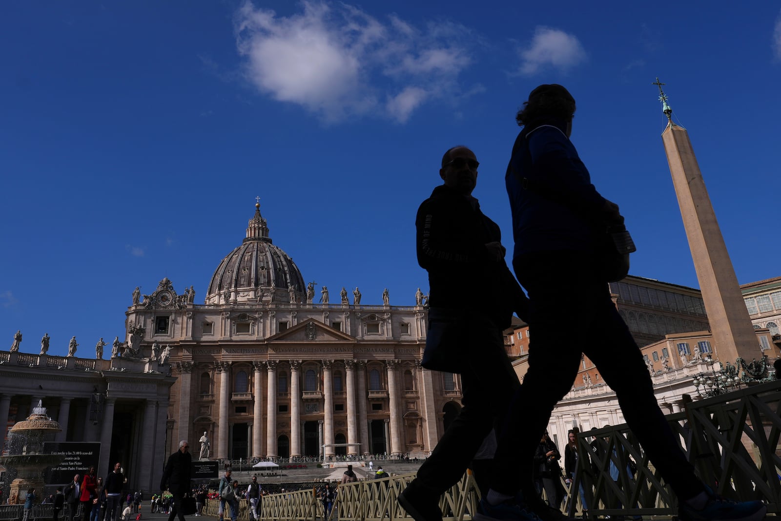 People visit St Peter's Square at The Vatican, Thursday, Feb. 27, 2025. (AP Photo/Kirsty Wigglesworth)