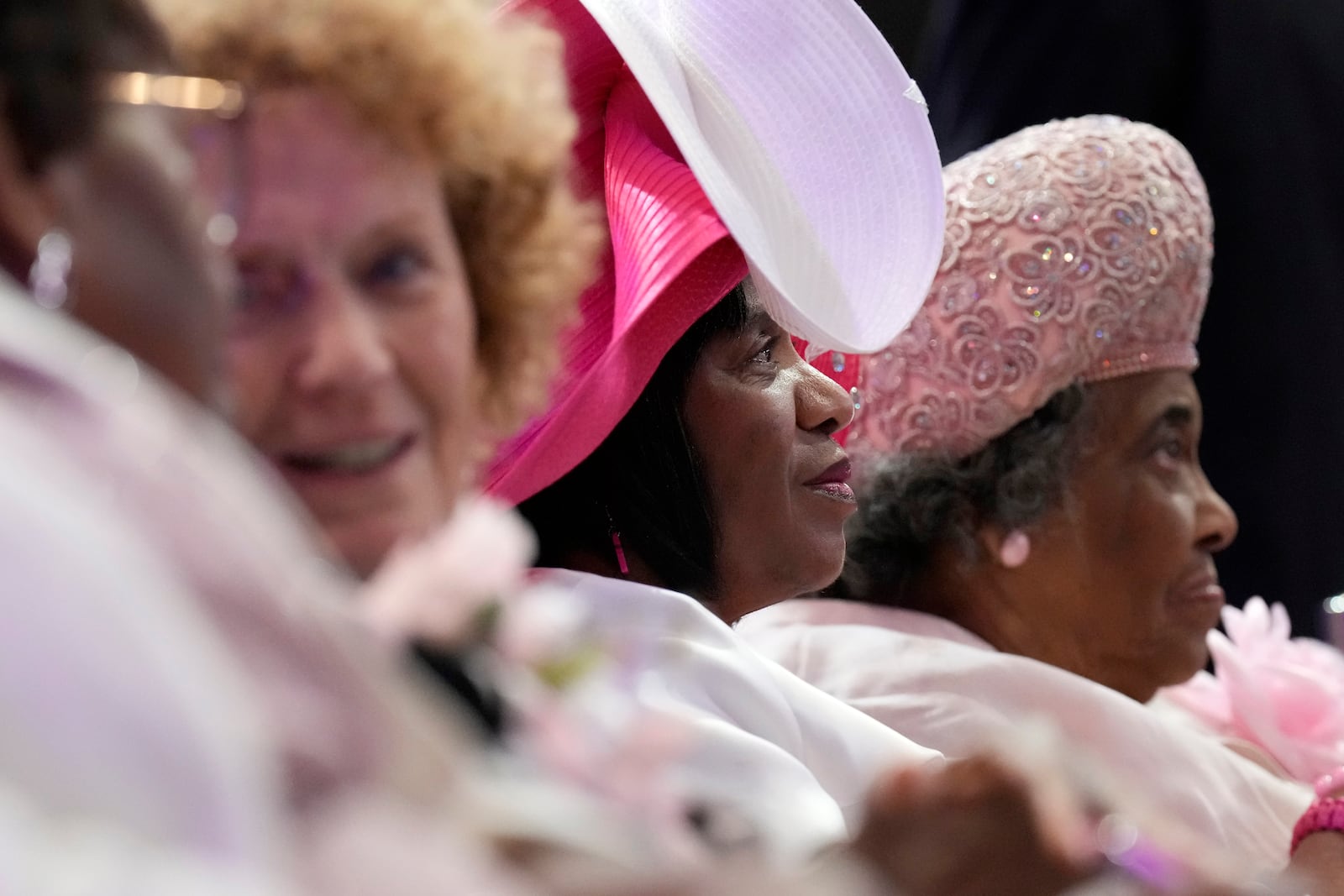 Attendees sit during a church service at New Birth Baptist Church before Democratic presidential nominee Vice President Kamala Harris speaks, in Stonecrest, Ga., Sunday, Oct. 20, 2024. (AP Photo/Jacquelyn Martin)