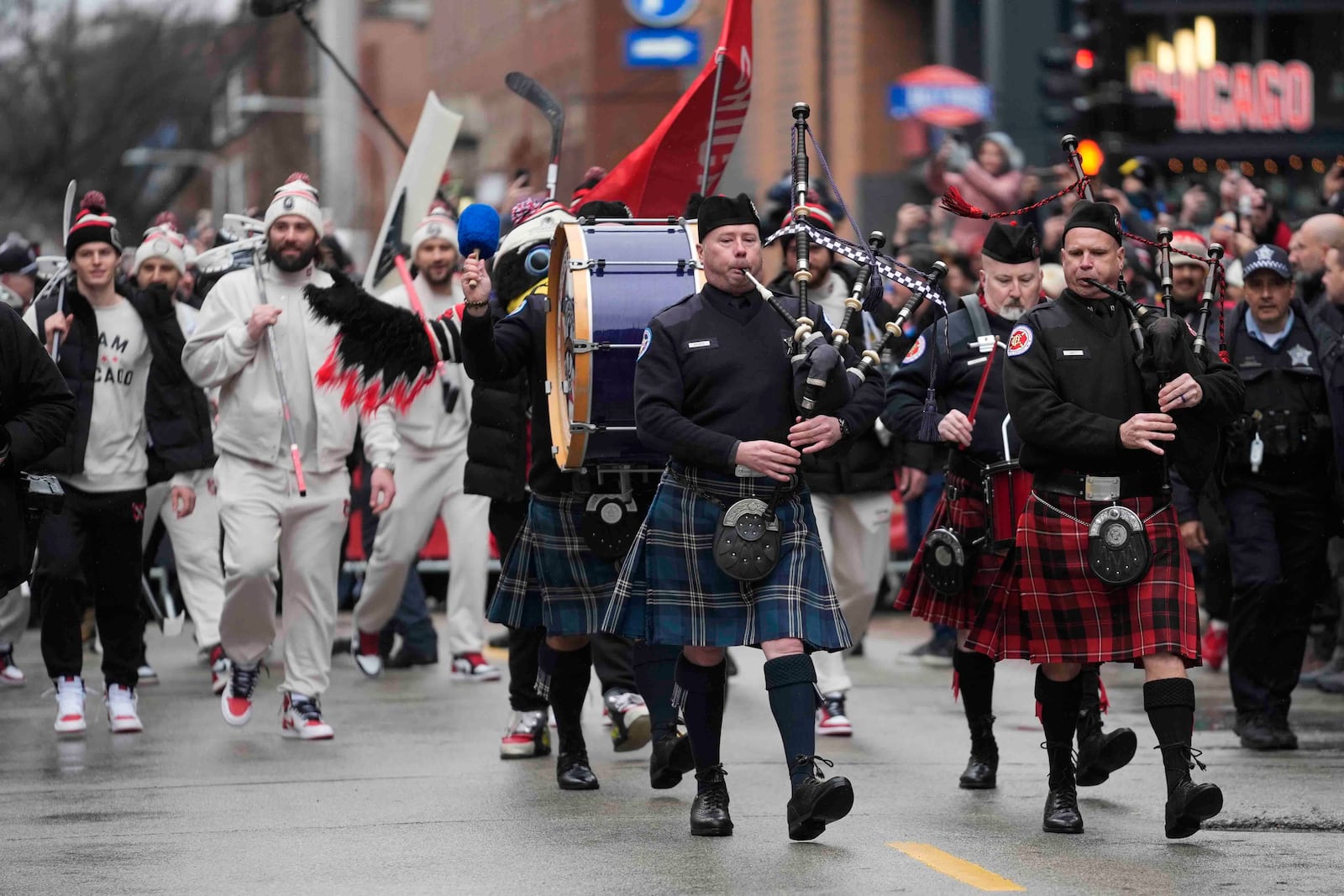 The Chicago Blackhawks arrive for the NHL Winter Classic outdoor hockey game between the Blackhawks and St. Louis Blues at Wrigley Field, Tuesday, Dec. 31, 2024, in Chicago. (AP Photo/Erin Hooley)