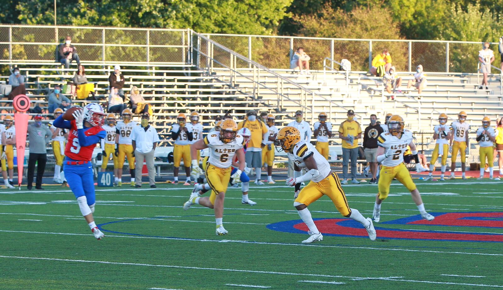 C.J. Hicks (1) of Alter football is an Ohio State football verbal commit. Here he is going for a tackle against Carroll.