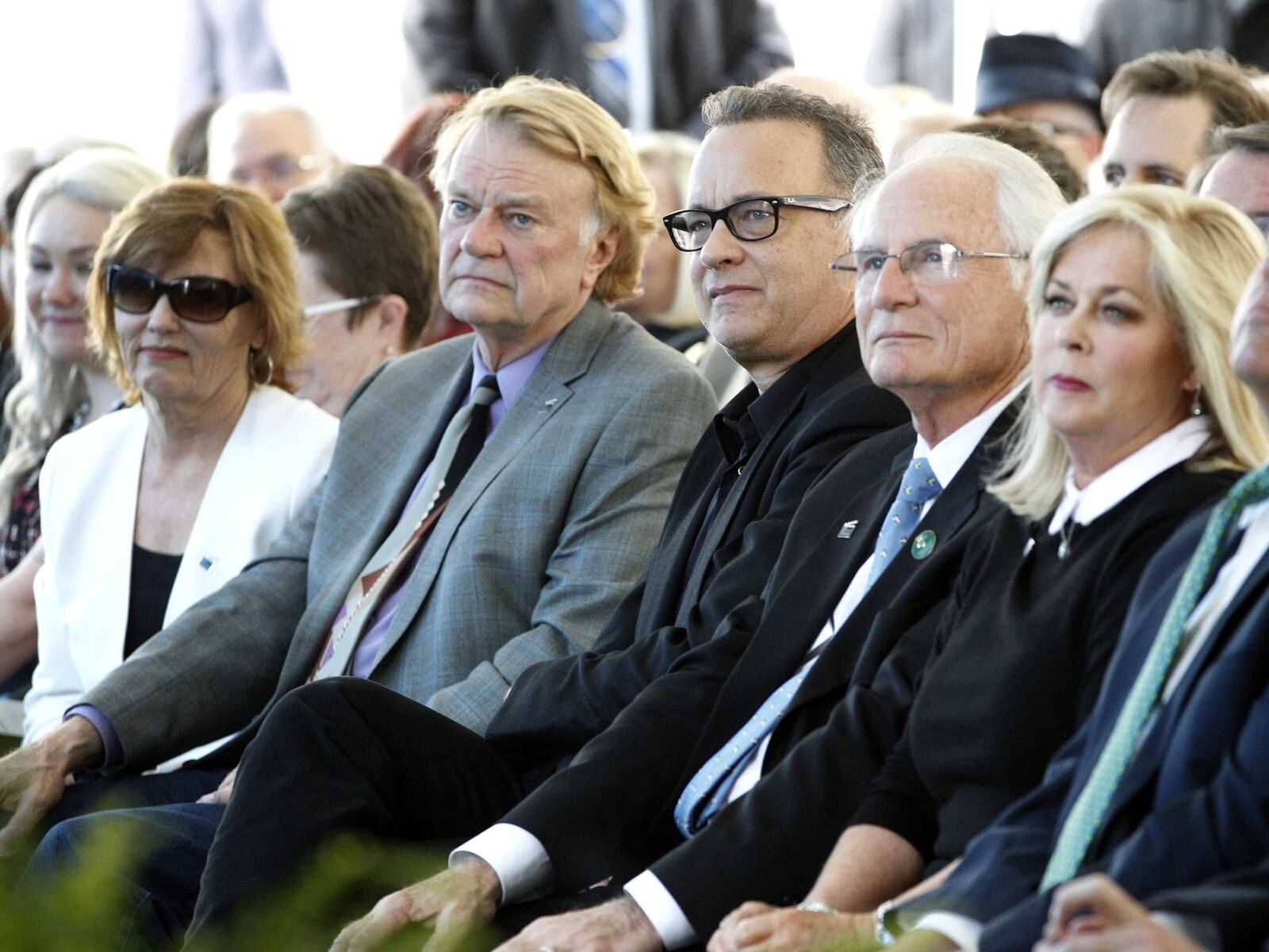 Actor Tom Hanks (center) participated in a ribbon-cutting ceremony for the new Tom Hanks Center for Motion Pictures at Wright State University on Tuesday. At left is W. Stuart McDowell, chair and artistic director for the Department of Theatre, Dance and Motion Pictures at Wright State and at right is Wright State University President David R. Hopkins. LISA POWELL / STAFF