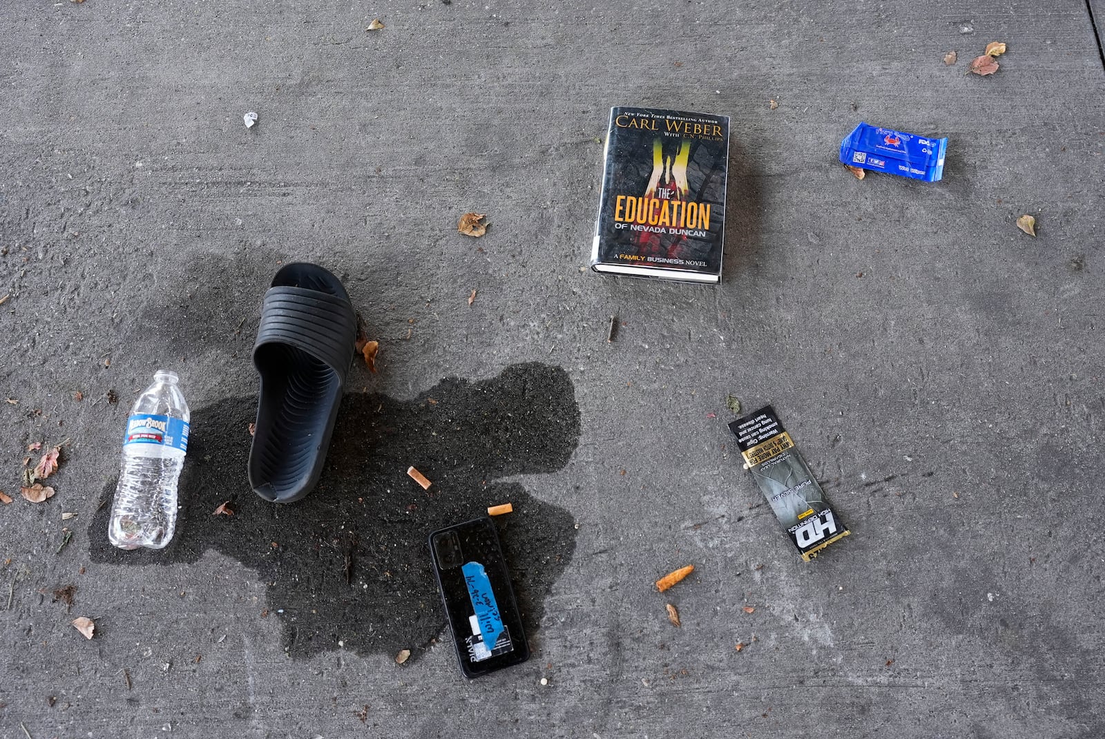 Possessions left behind are seen as Louisiana State police give instructions to people living in a homeless encampment to move to a different pre-designated location as they perform a sweep in advance of a Taylor Swift concert in New Orleans, Wednesday, Oct. 23, 2024. (AP Photo/Gerald Herbert)