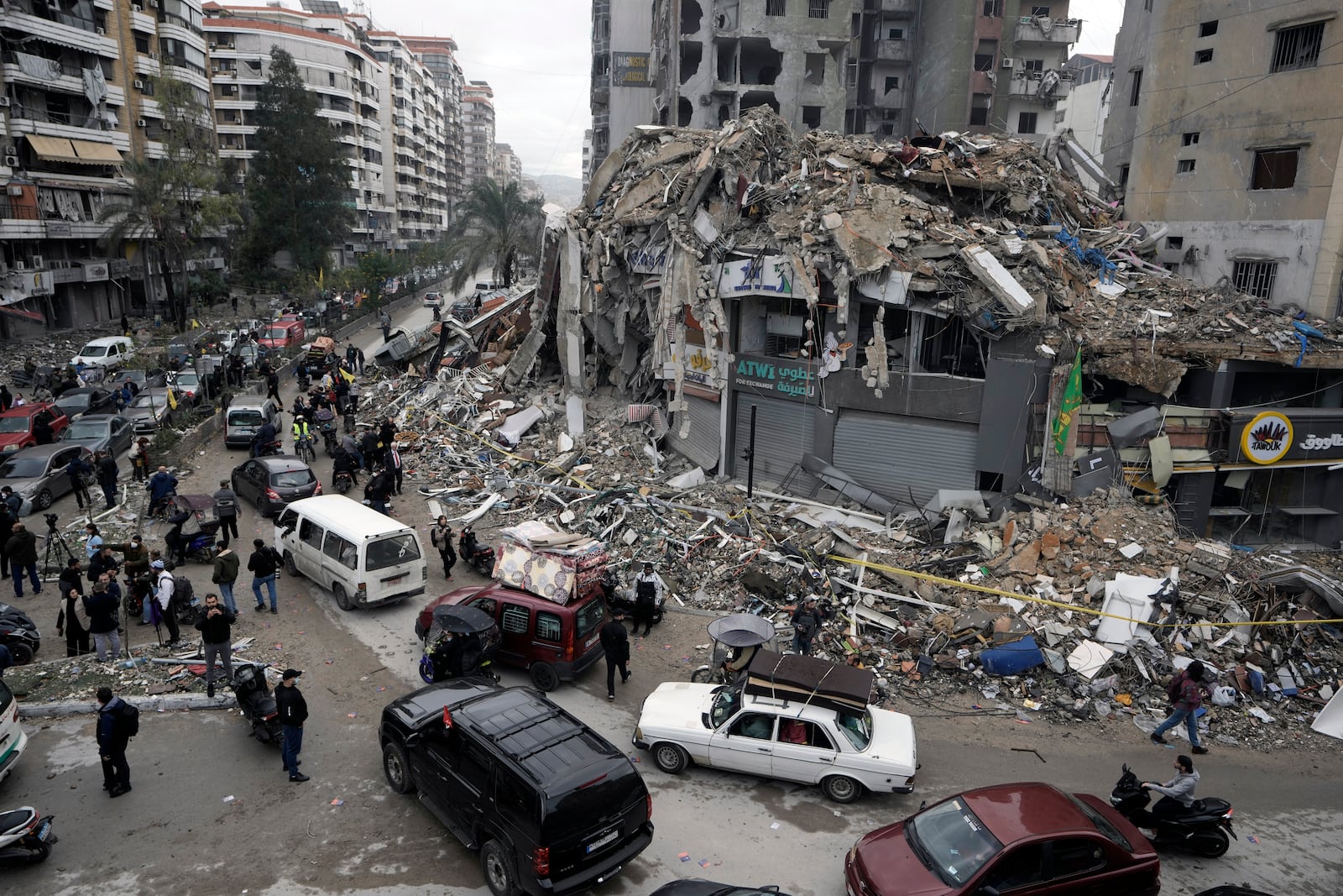 Displaced residents return to Dahiyeh, in Beirut, Lebanon, following a ceasefire between Israel and Hezbollah that went into effect, Nov. 27, 2024. (AP Photo/Bilal Hussein)