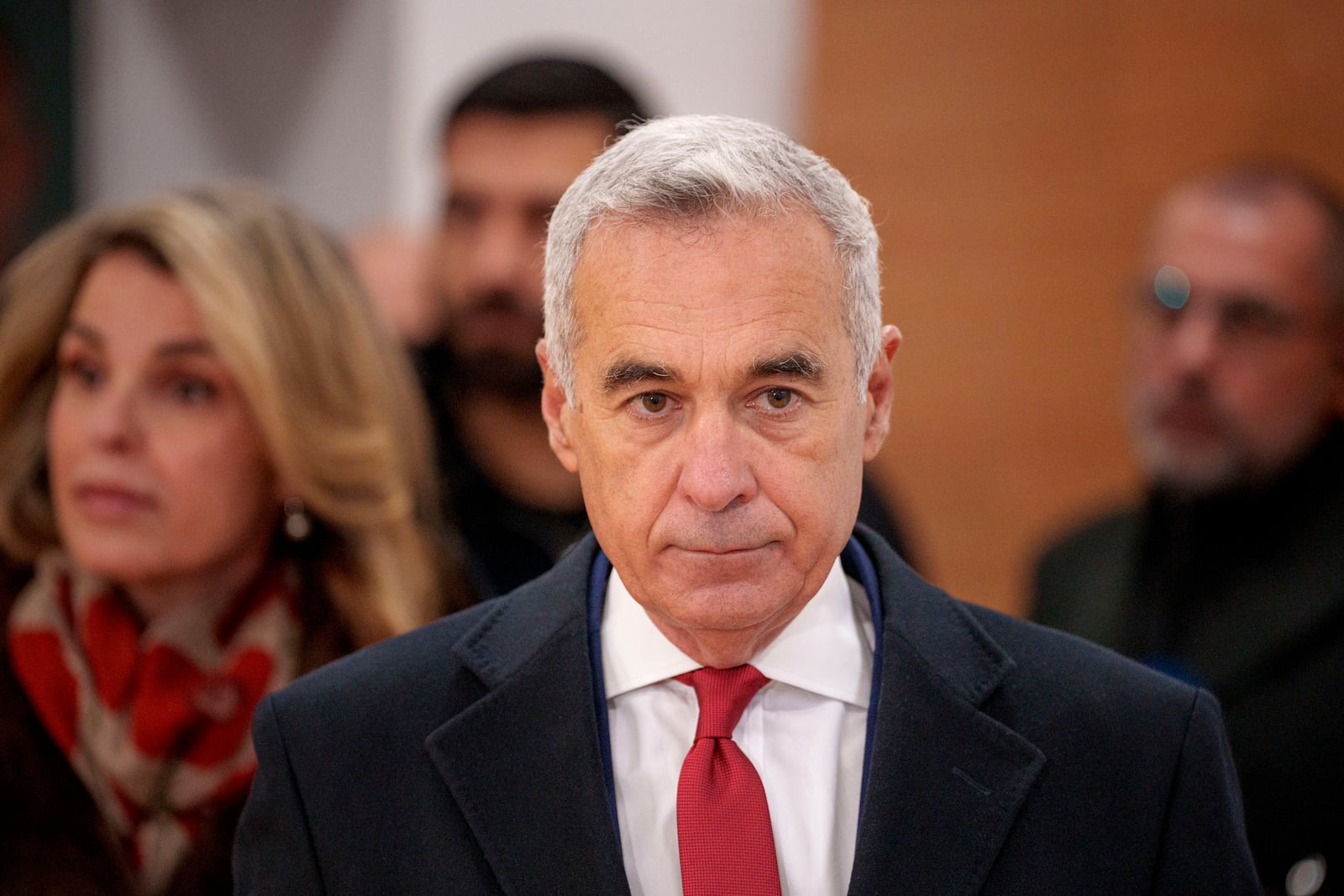 Calin Georgescu, an independent candidate for president who came first after the first round of presidential election, arrives at a voting station to cast his vote in the country's parliamentary election in Mogosoaia, Romania, Sunday, Dec. 1, 2024. (AP Photo/Andreea Alexandru)