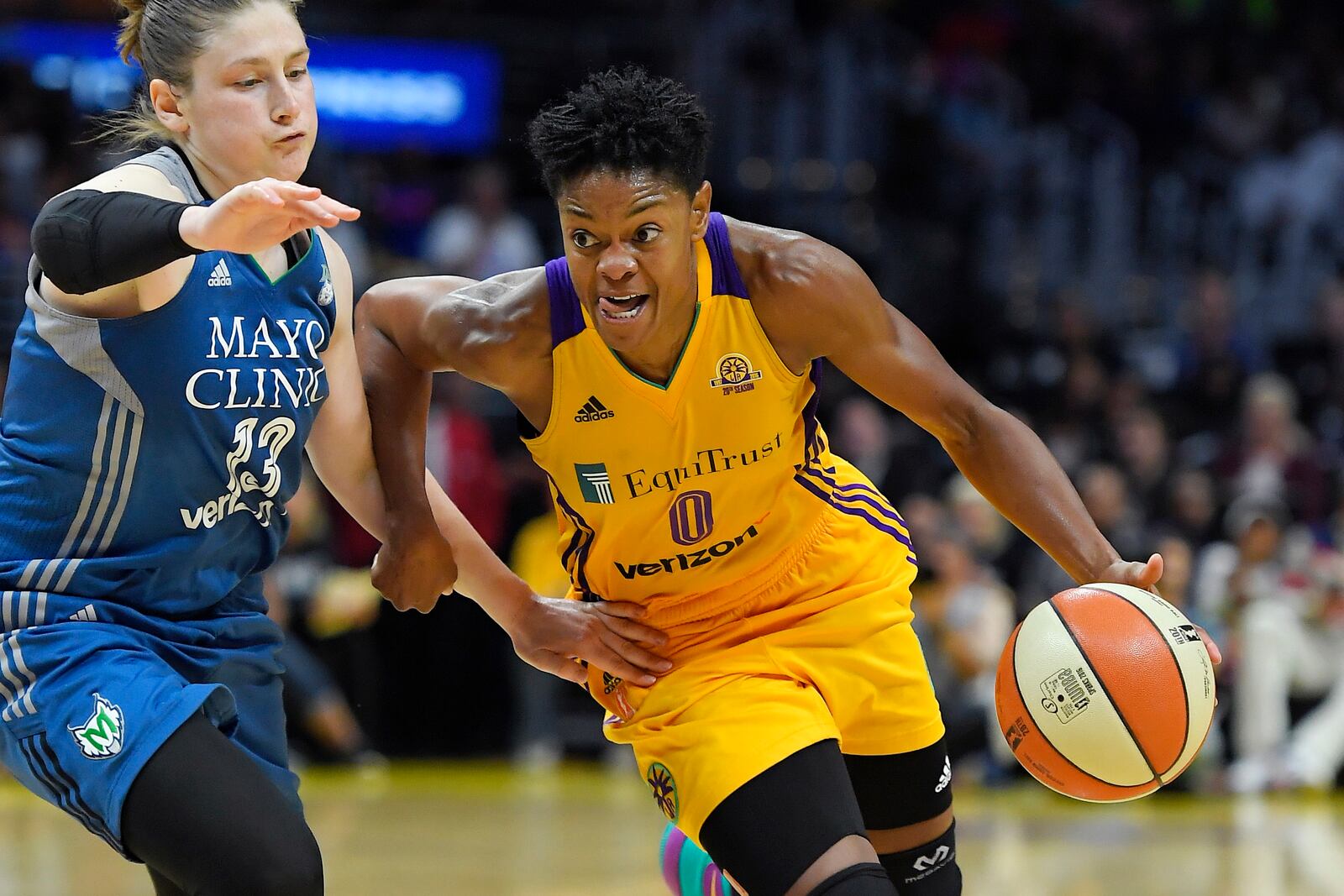 FILE - Los Angeles Sparks guard Alana Beard, right, drives past Minnesota Lynx guard Lindsay Whalen during the second half in Game 4 of the WNBA basketball finals, Sunday, Oct. 16, 2016, in Los Angeles. (AP Photo/Mark J. Terrill, File)