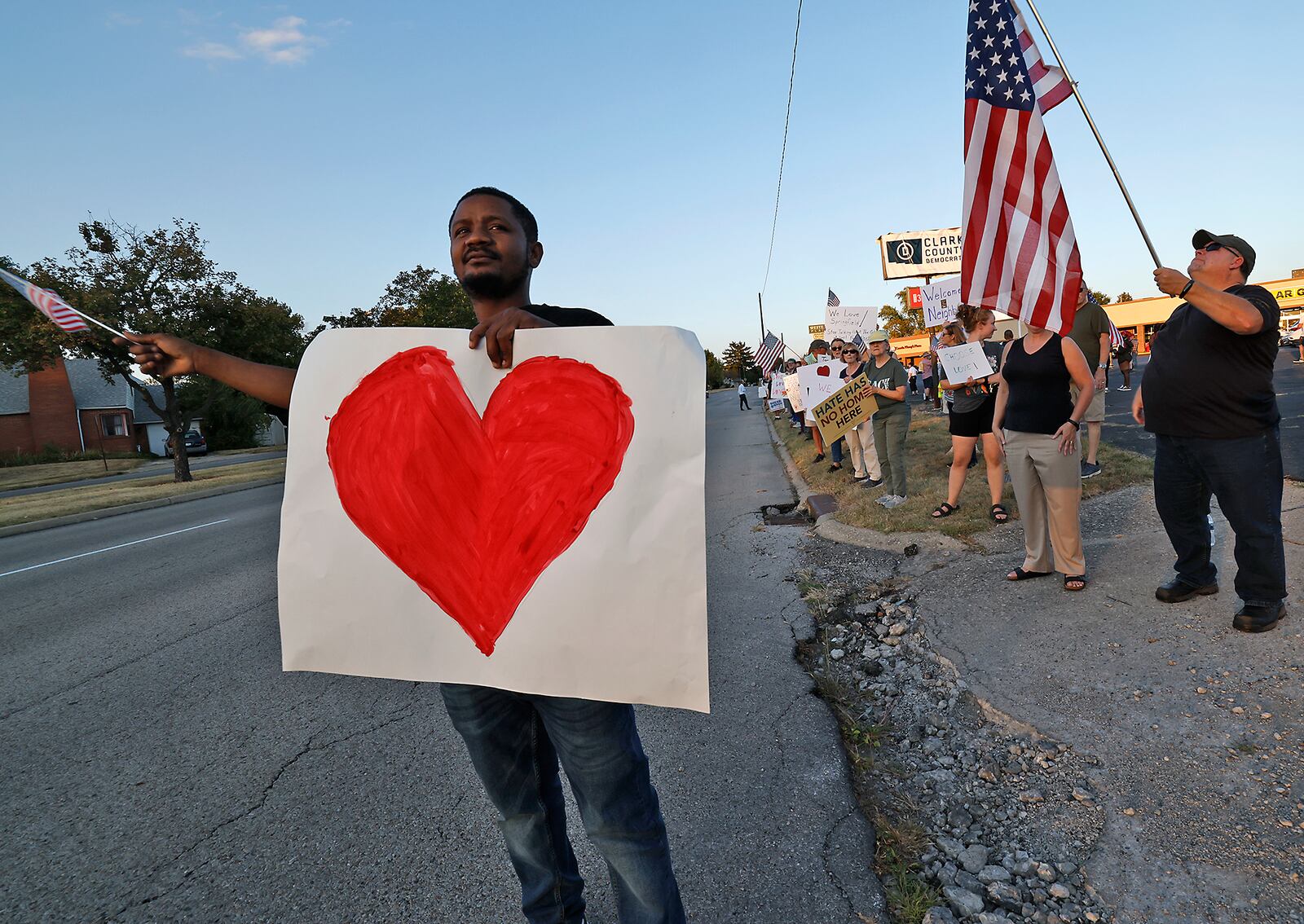 Petuel Jeanjacques, a Haitian immigrant, participates in a Peace Rally at the Clark County Democratic Party on Park Road in Springfield Wednesday, Sept. 18, 2024. BILL LACKEY/STAFF