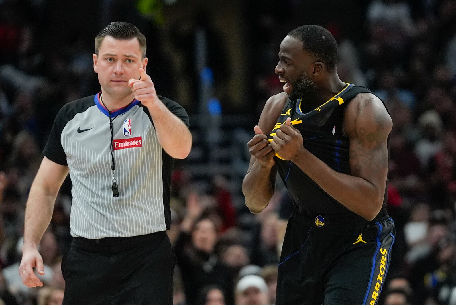 Golden State Warriors forward Draymond Green, right, argues with a call during the first half of an NBA basketball game against the Chicago Bulls, Saturday, Feb. 8, 2025, in Chicago. (AP Photo/Erin Hooley)