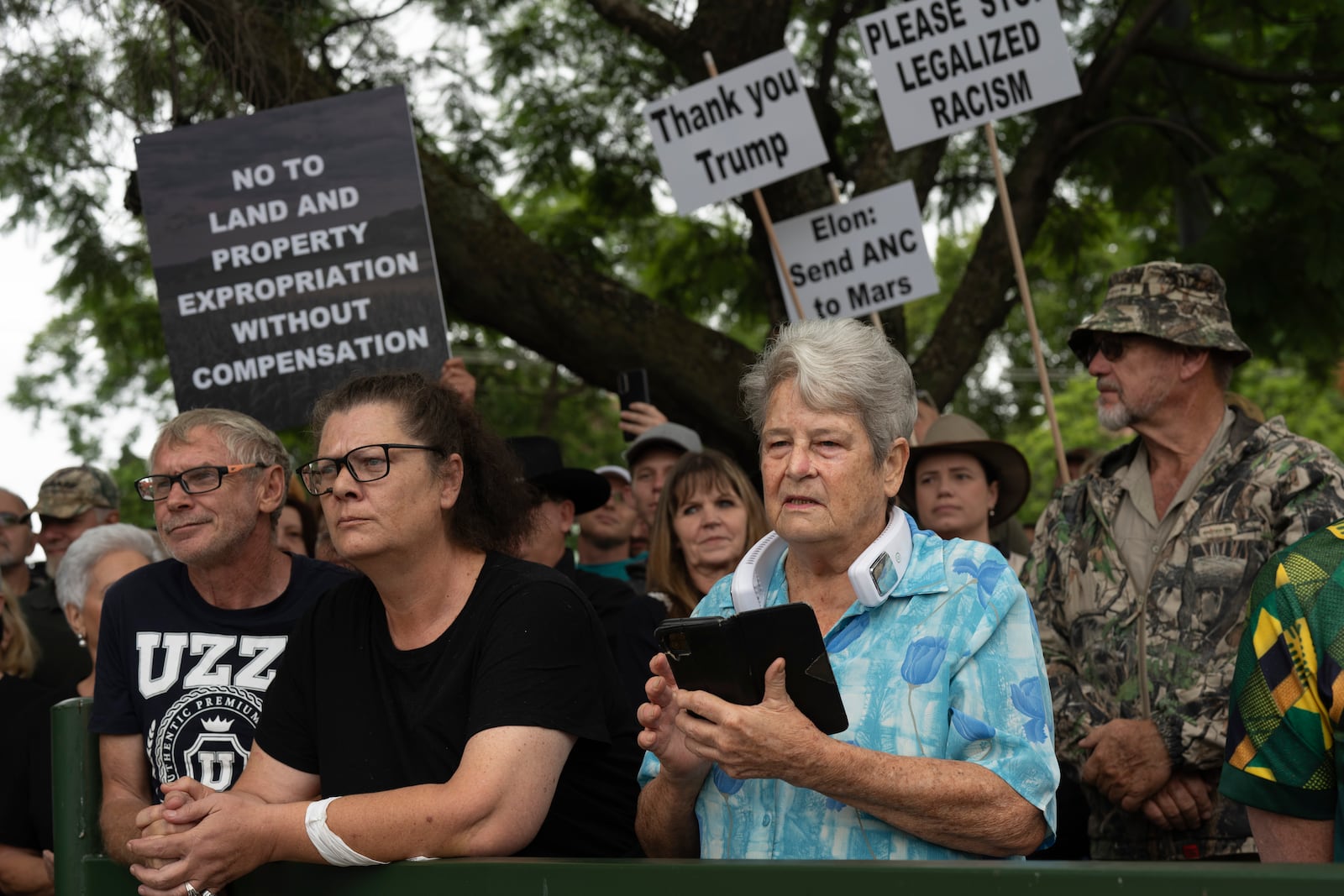 FILE - White South Africans demonstrate in support of U.S. President Donald Trump in front of the U.S. embassy in Pretoria, South Africa, Feb. 15, 2025. (AP Photo/Jerome Delay, File)